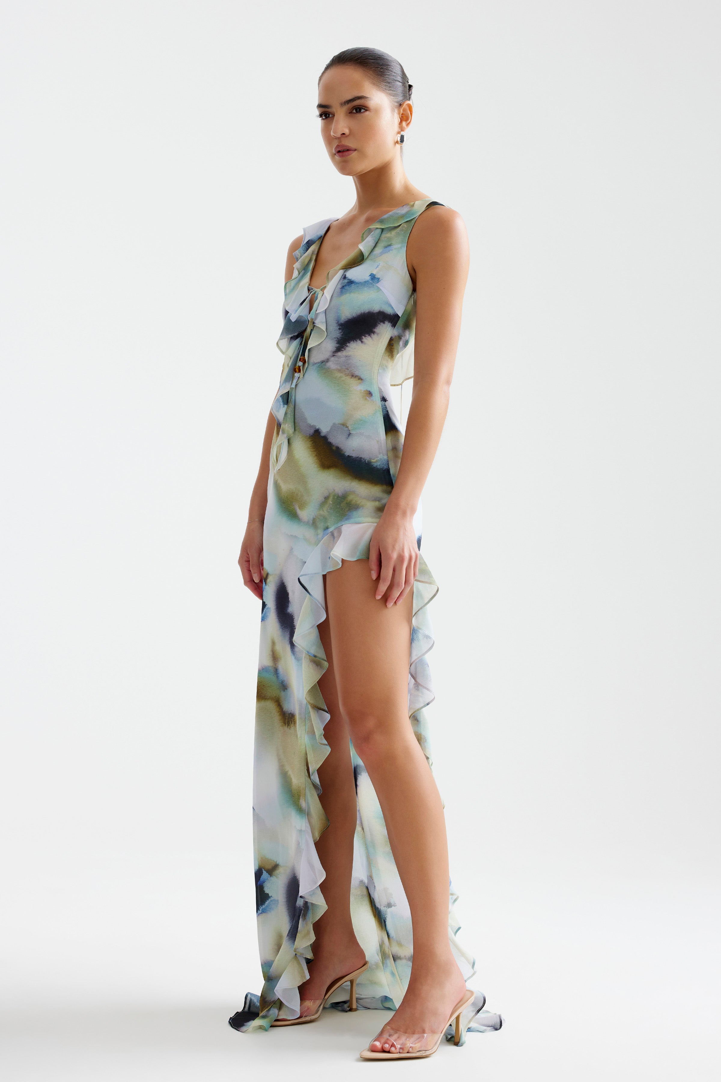 Laguna Dress featuring a ruffled split and small train in a soft blue mineral print for formal and cocktail events by Studio Lexi