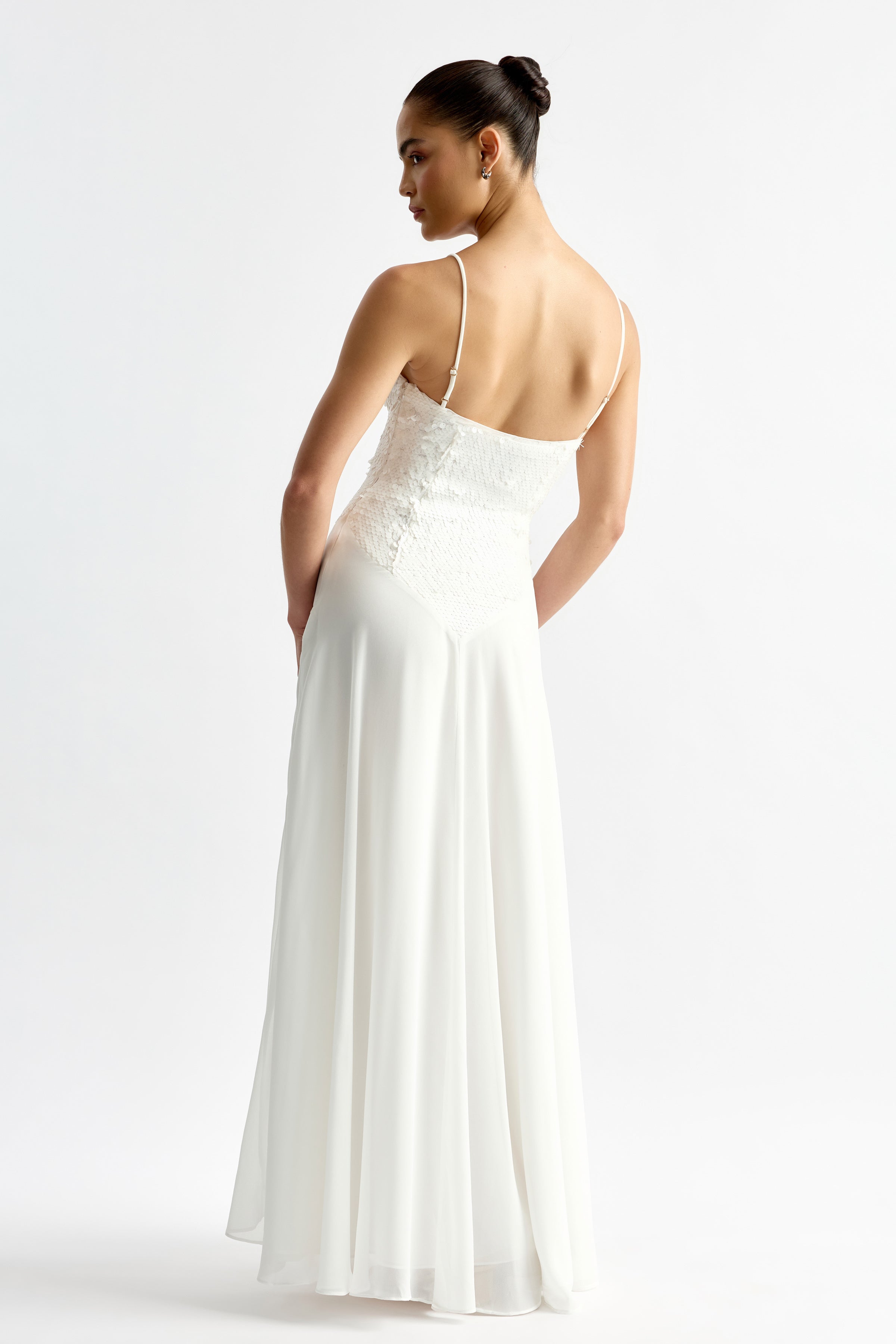 Leandre Dress featuring a delicate lace bodice and flowing chiffon skirt with thin straps in elegant ivory by Studio Lexi