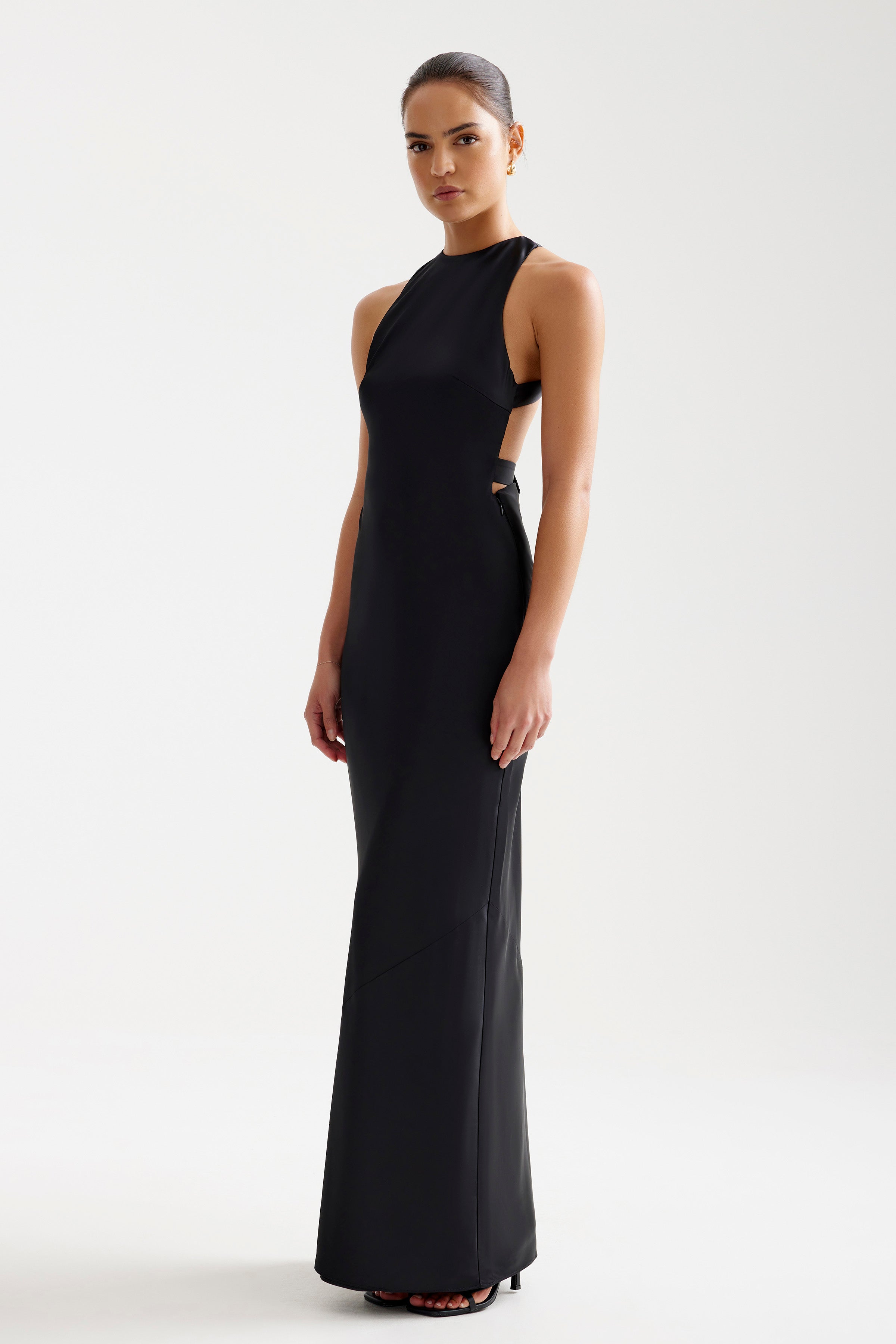 Liora Dress sleek high-neck silhouette with backless cutout and buckle accents in elegant black for formal occasions