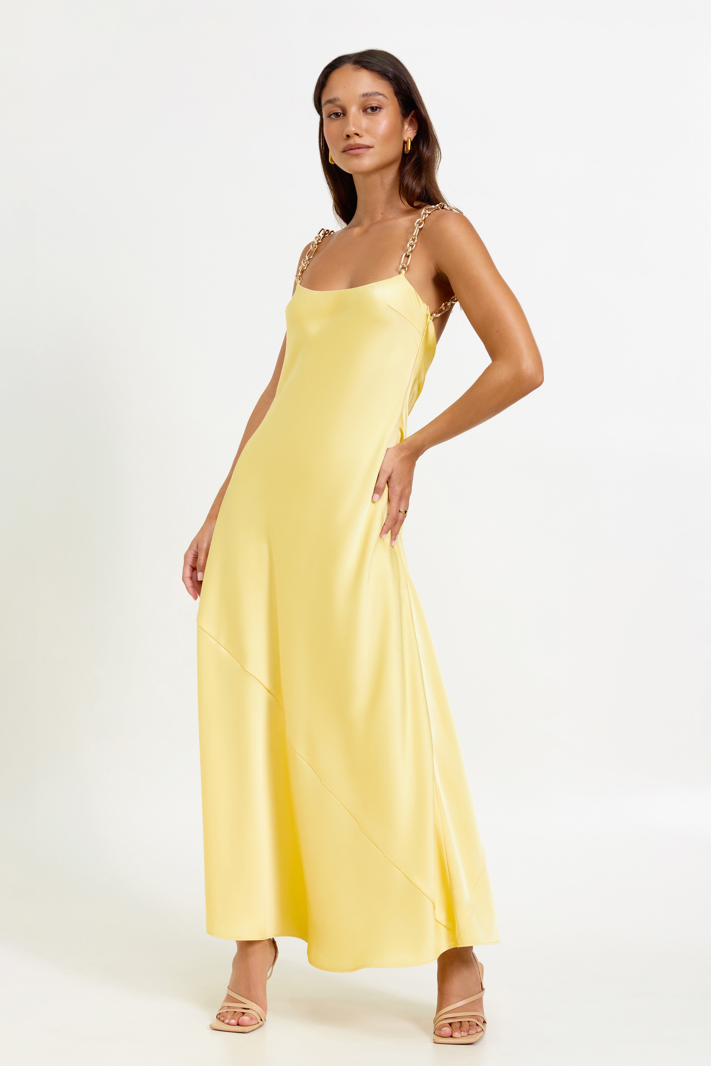Lisandra Dress featuring chain strap detail and backless design in pineapple yellow for formal and party occasions by Studio Lexi
