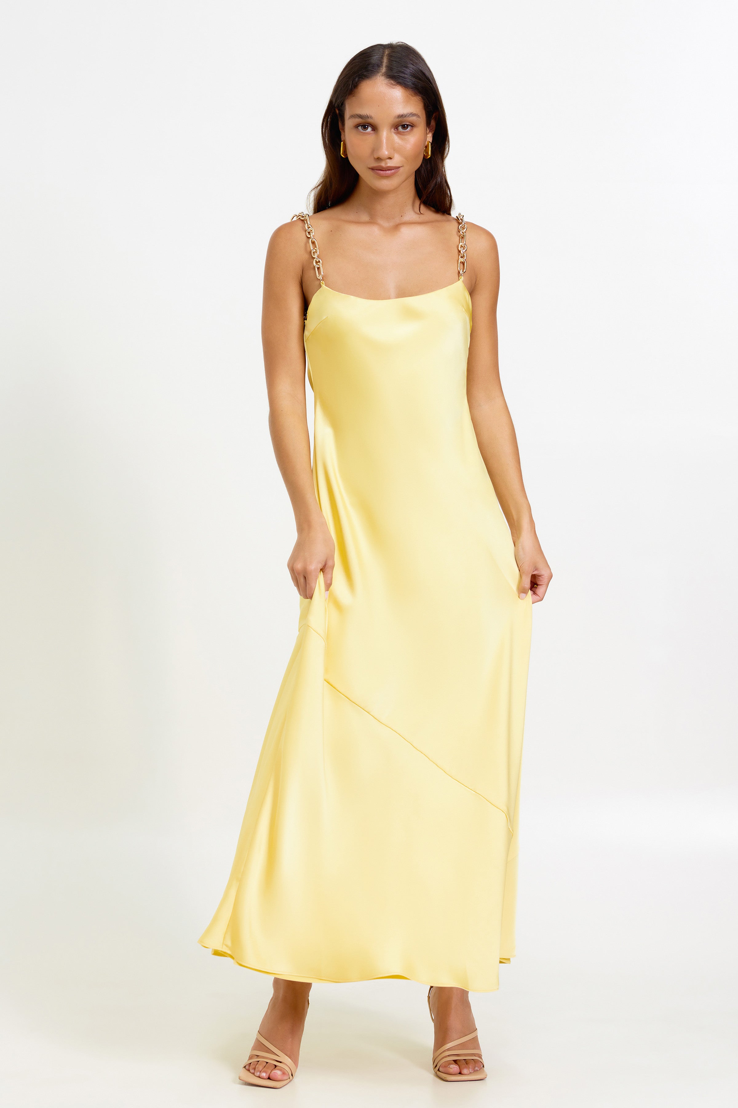 Lisandra Dress featuring chain strap accents and a flowing silhouette in pineapple yellow for formal and wedding guest occasions