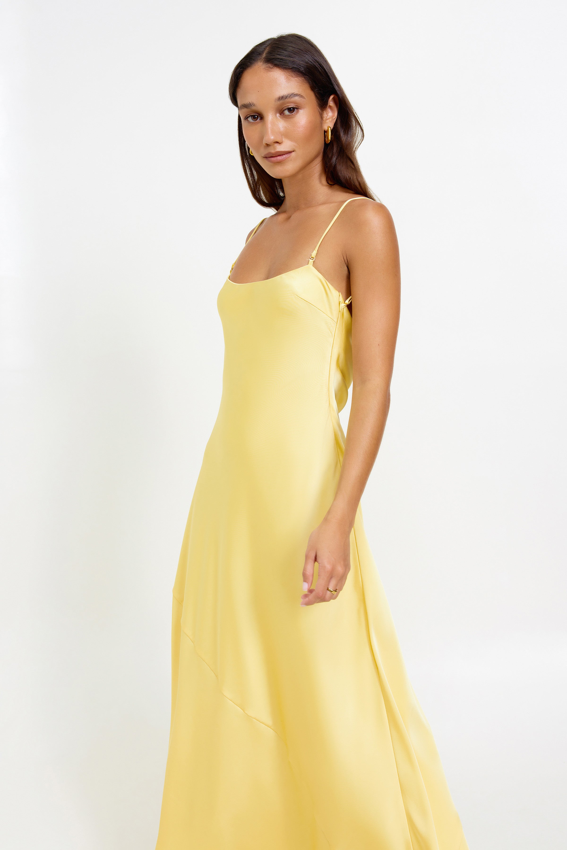 Lisandra Dress featuring a sleek silhouette with adjustable straps in pineapple yellow for formal and wedding guest occasions by Studio Lexi