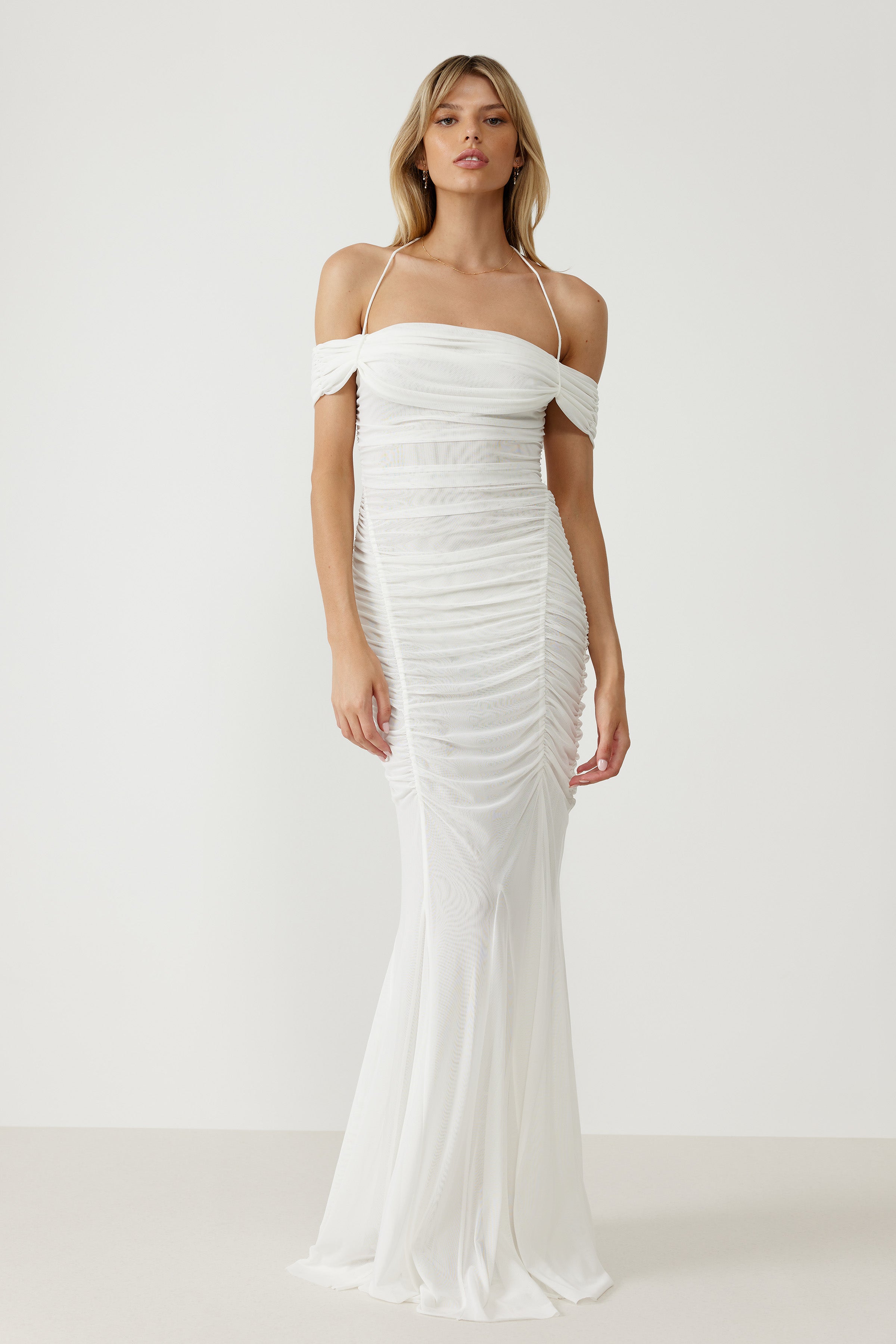Livia Dress featuring off-shoulder sleeves, ruched stretch mesh fabric, delicate straps, and a fitted silhouette in white for formal occasions