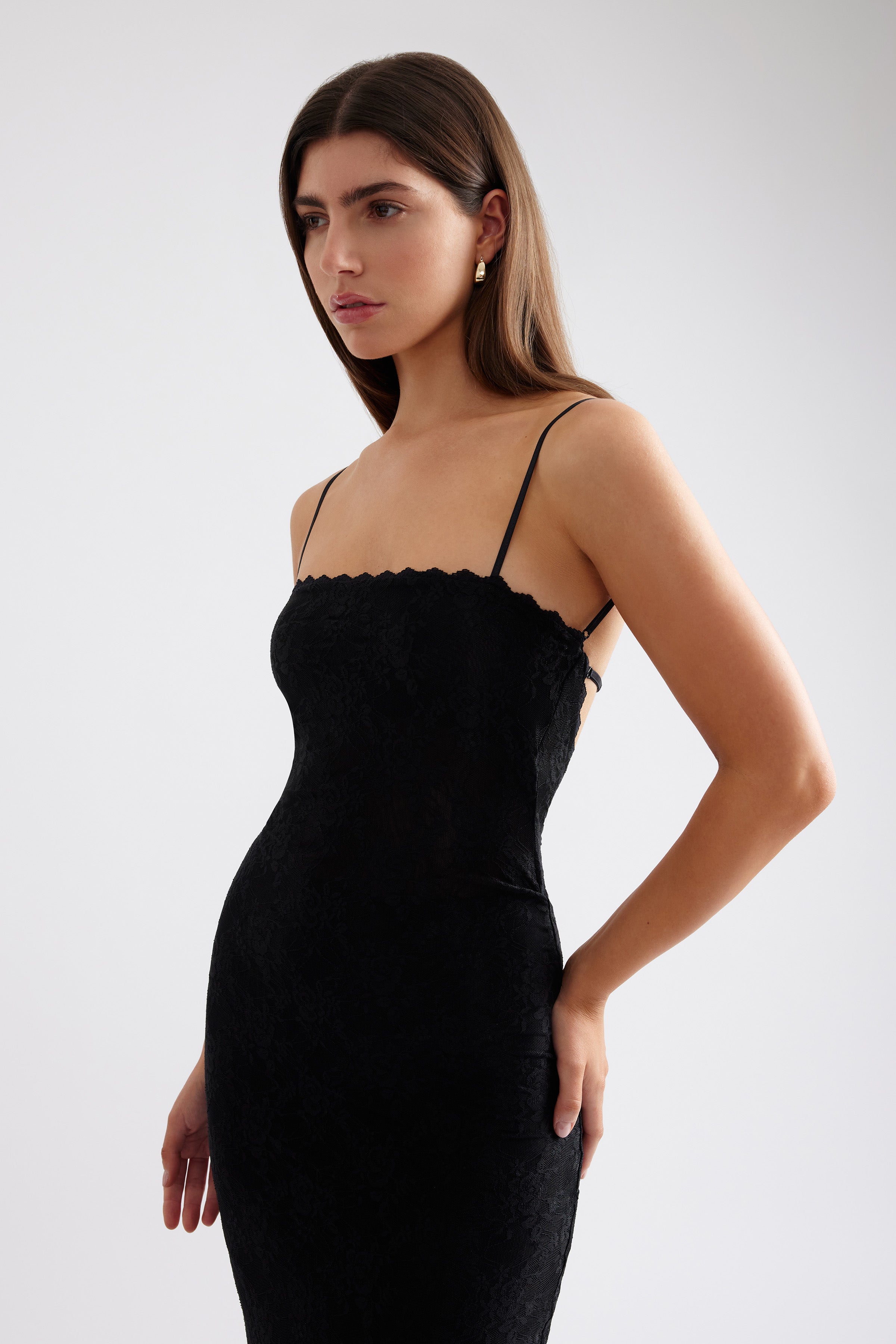 Liza Dress fitted silhouette with delicate straps and subtle lace texture in black for cocktail and evening occasions by Studio Lexi