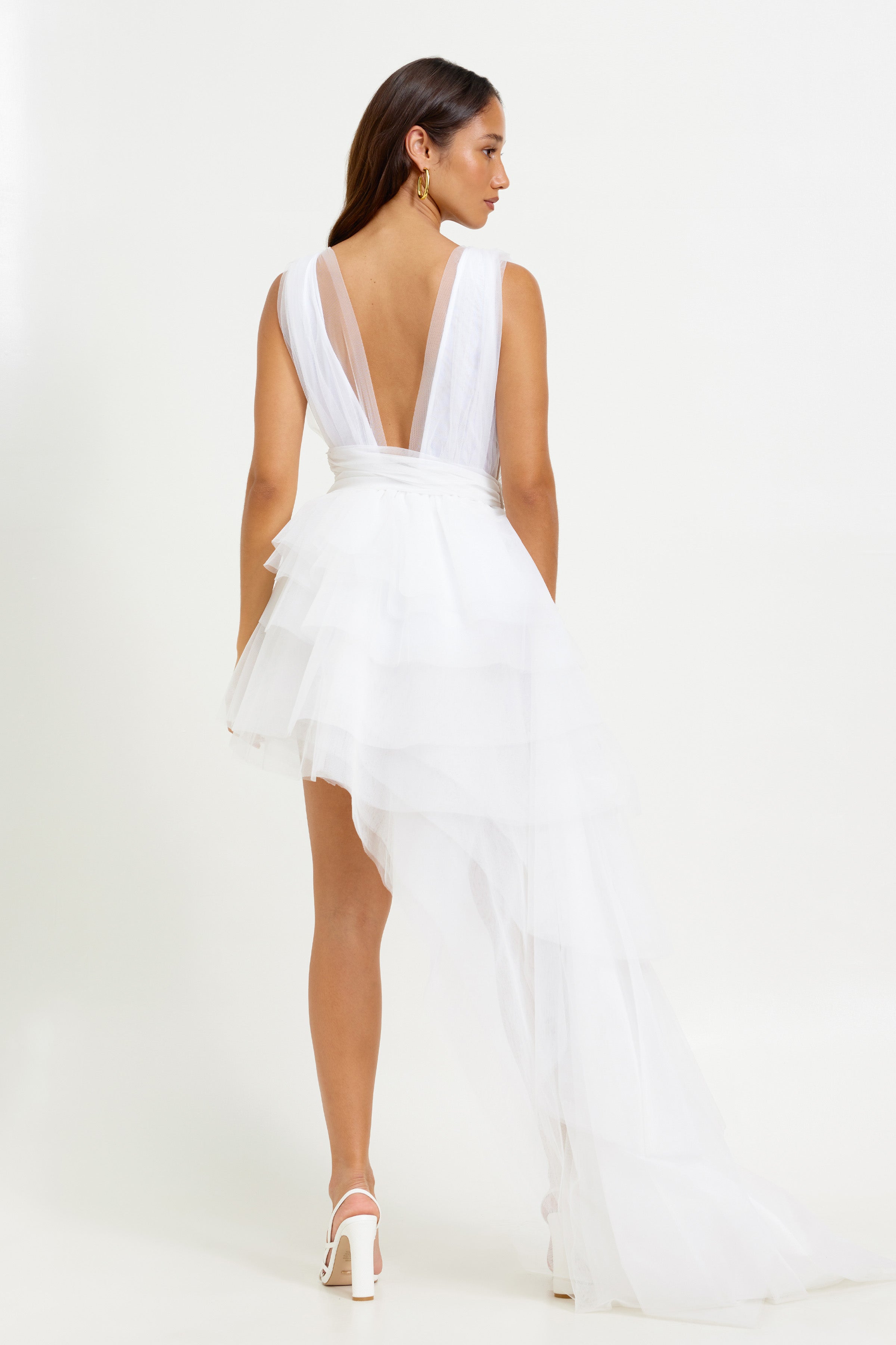 Lola Dress featuring a deep V back and layered tulle asymmetrical skirt with small train in white for cocktail occasions