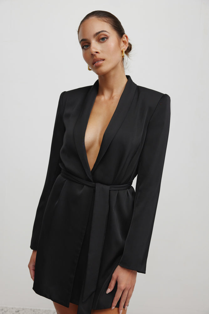 Lucio Jacket Dress featuring a deep plunge neckline, belted waist, and long sleeves in black for cocktail and formal wear