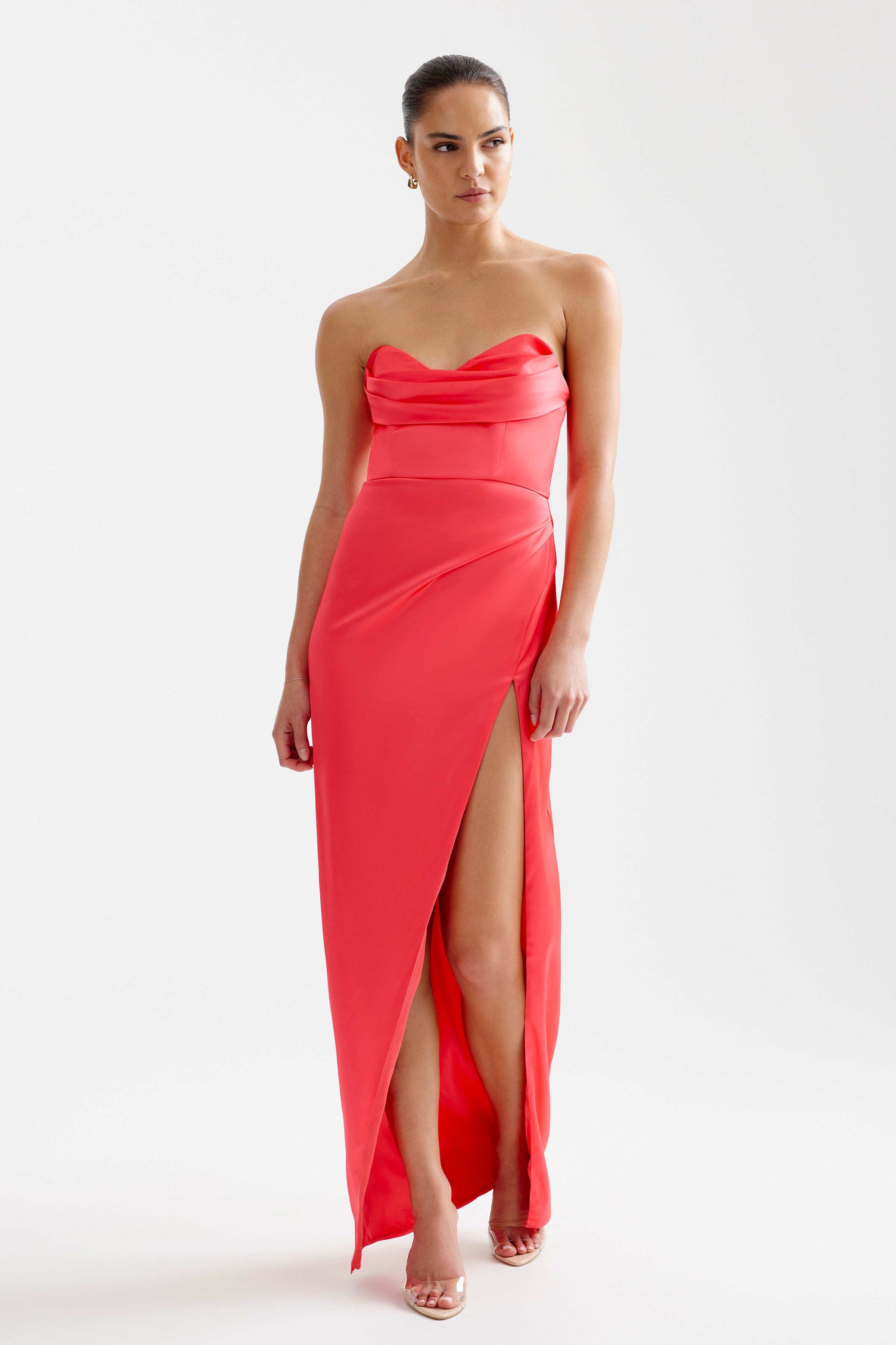 Lucy Dress strapless silhouette with draped bodice and thigh-high split in coral satin for formal and bridesmaid occasions by Studio Lexi
