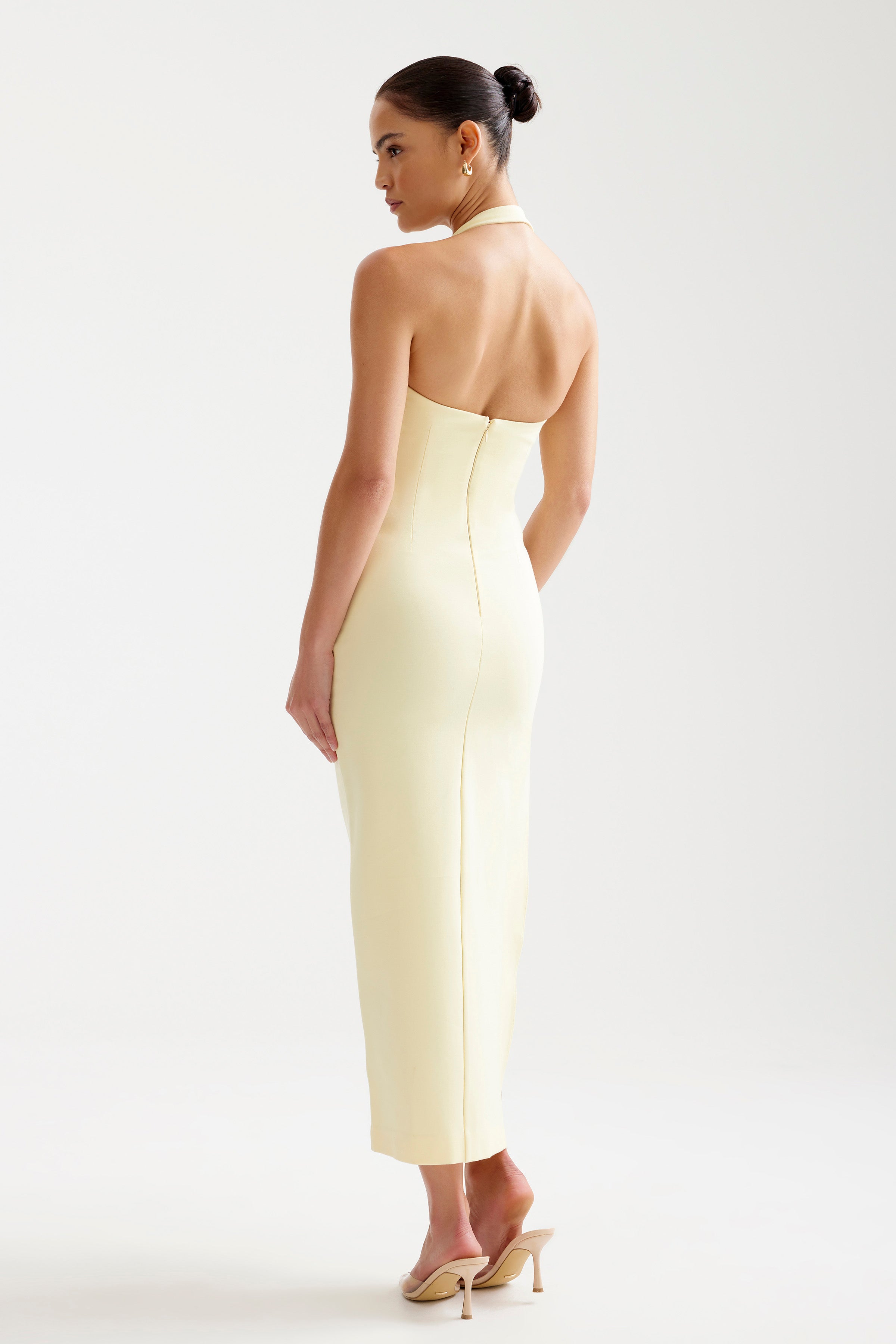 Luna Dress featuring a fitted halter neckline and back zipper in soft limoncello by Studio Lexi for cocktail occasions