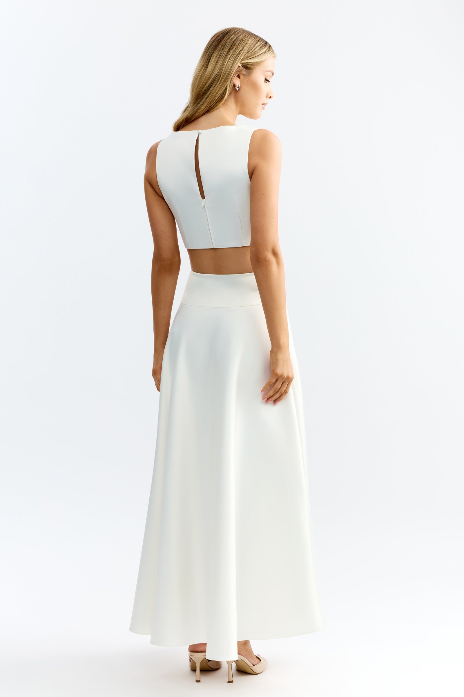 Lydia Set featuring sleeveless crop top with back keyhole and flowing maxi skirt in ivory by Studio Lexi