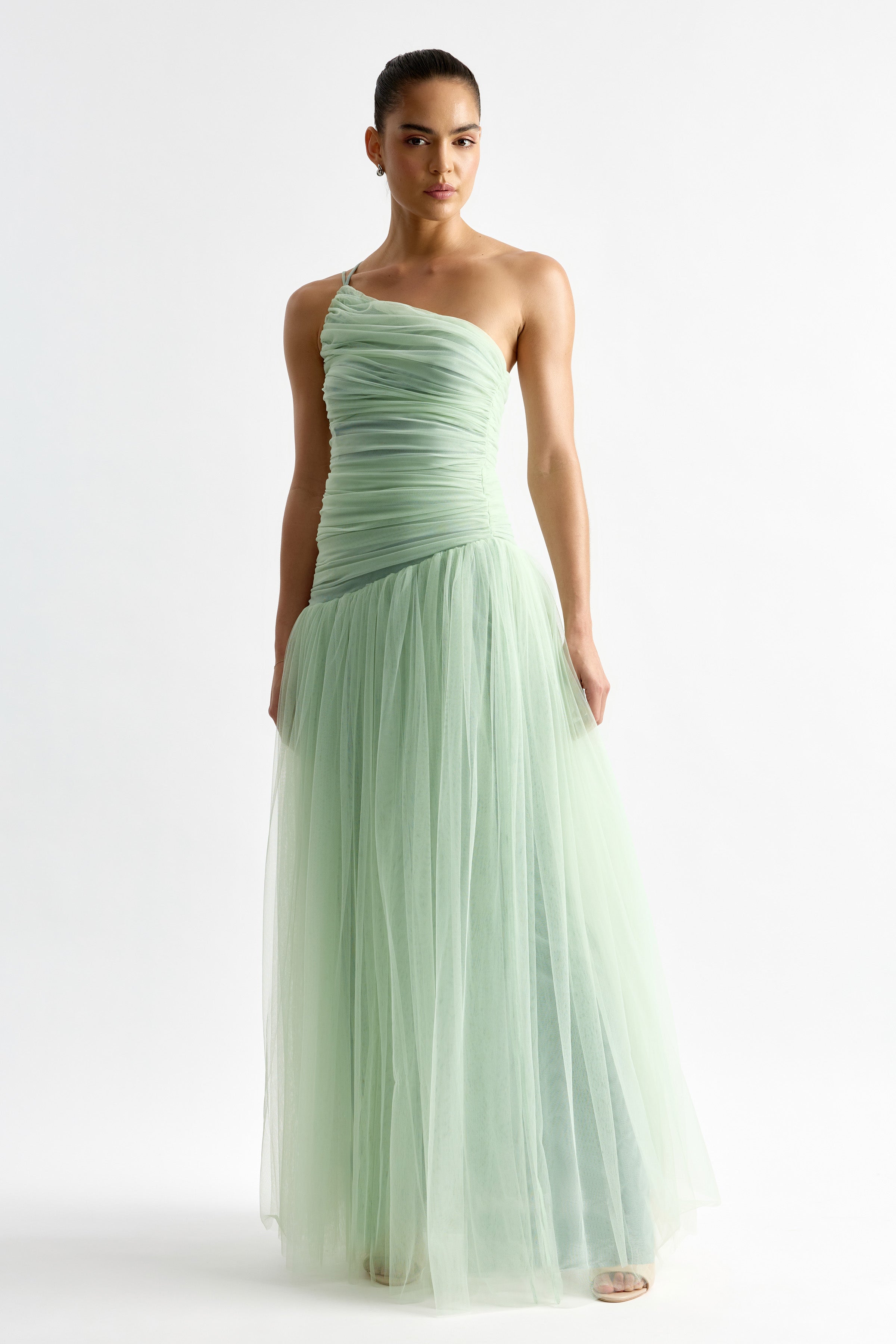 Madeleine Dress featuring ruched one-shoulder bodice and flowing tulle skirt in soft mint for formal occasion wear