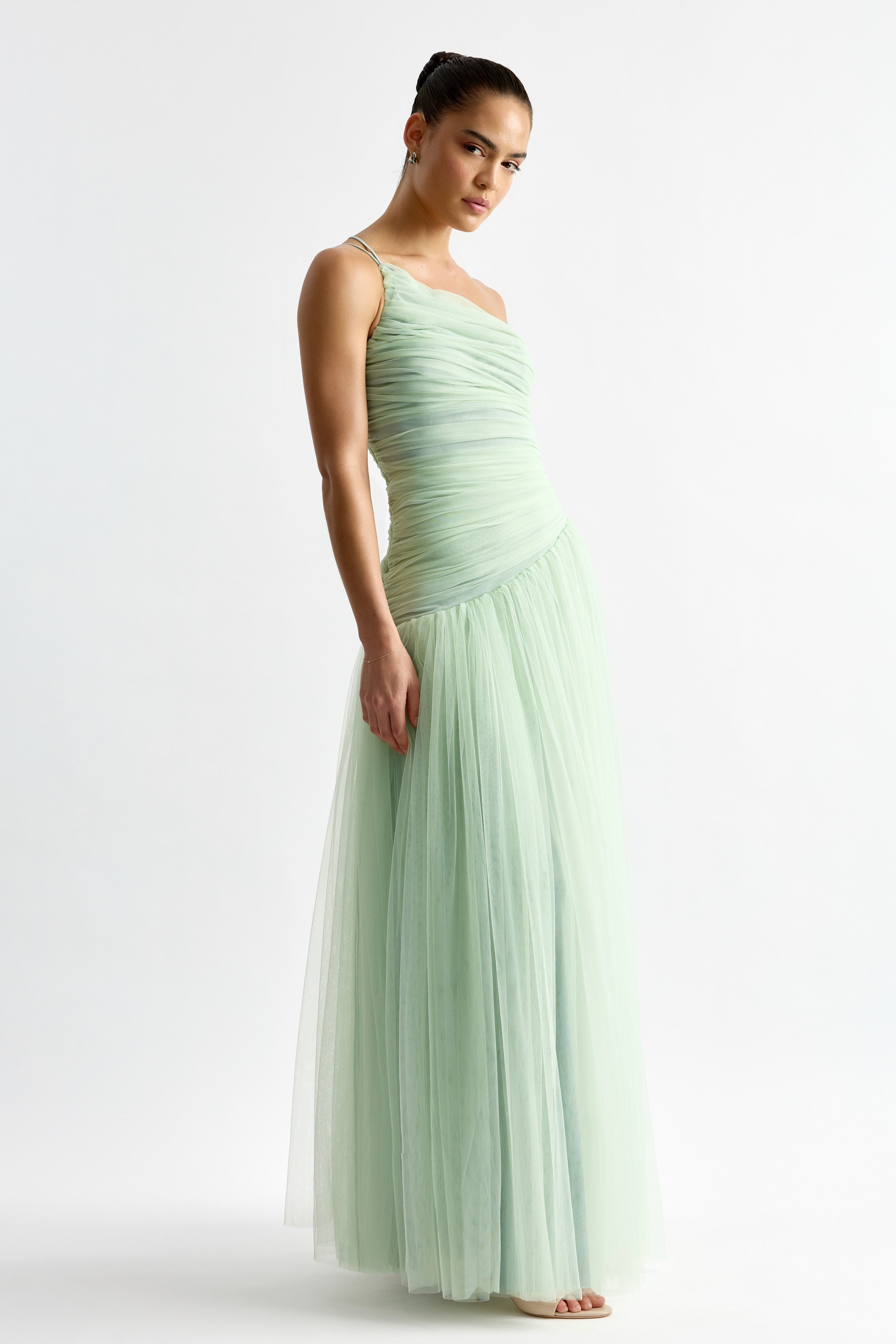 Madeleine Dress in mint featuring a ruched bodice with delicate straps and flowing tulle skirt for formal occasions