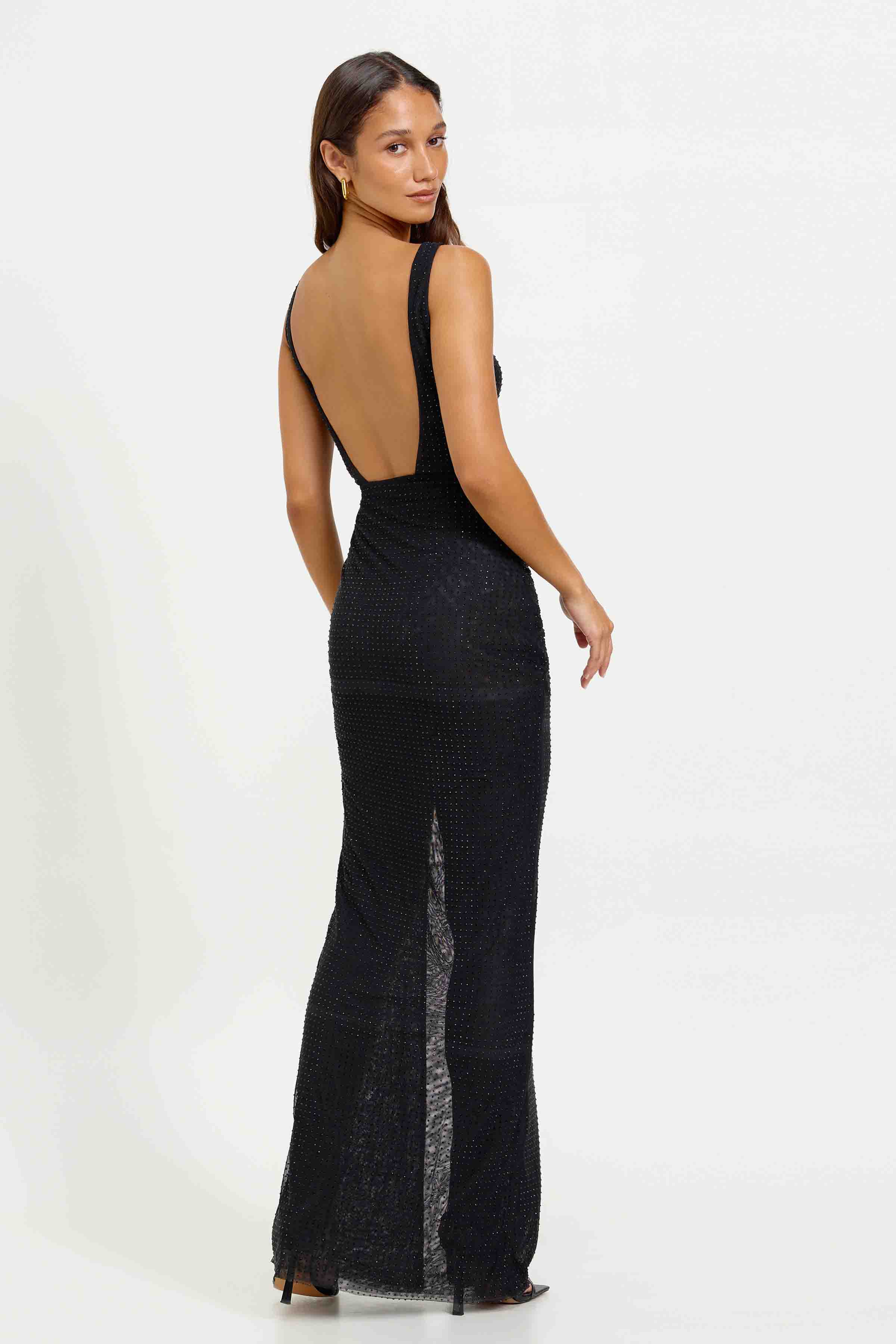 Maree Dress featuring a backless design with a low scoop back and subtle texture in black for formal evening wear