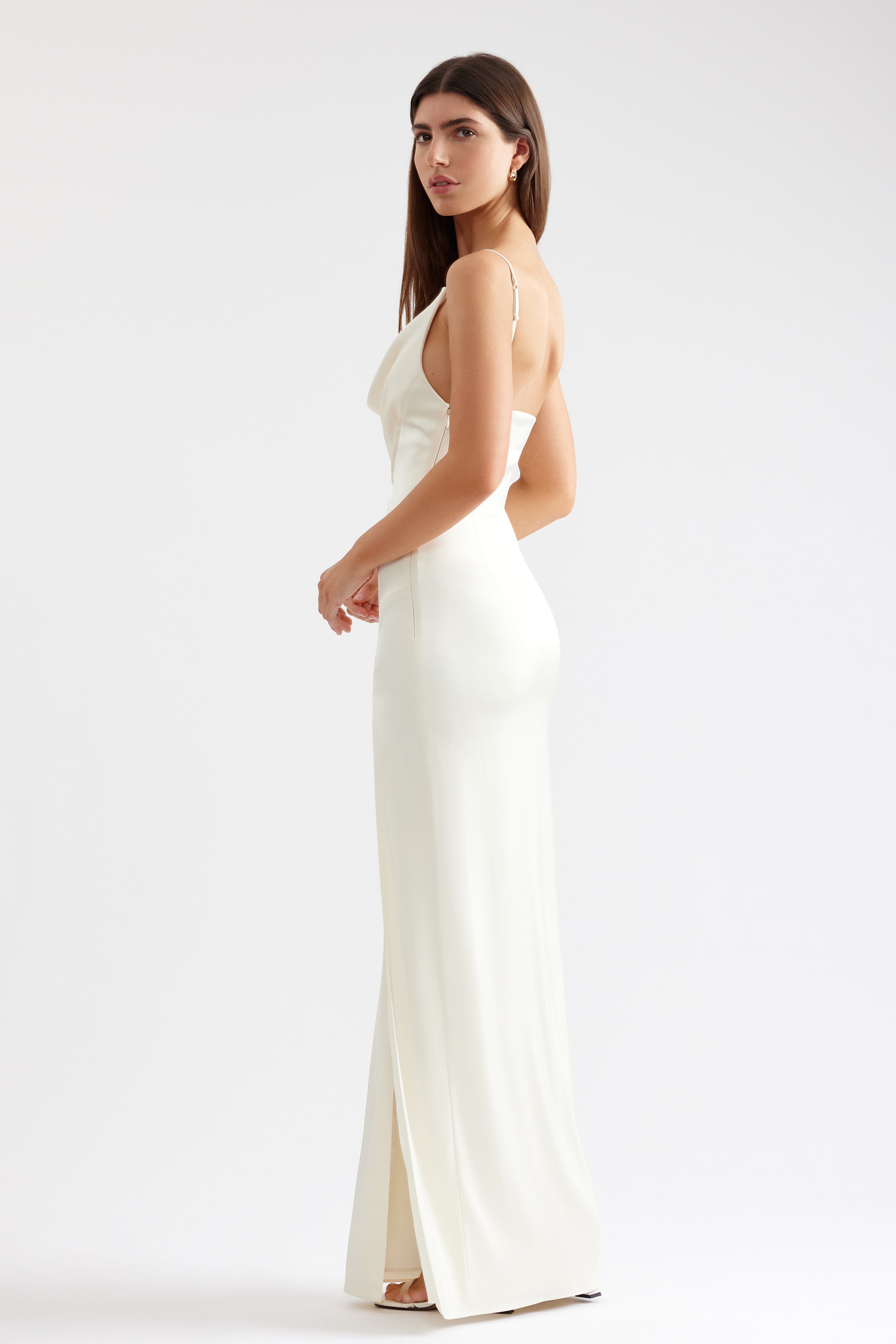 Marion Dress sleek silhouette with draped neckline, slim straps, and side split in butter cream for formal occasions by Studio Lexi