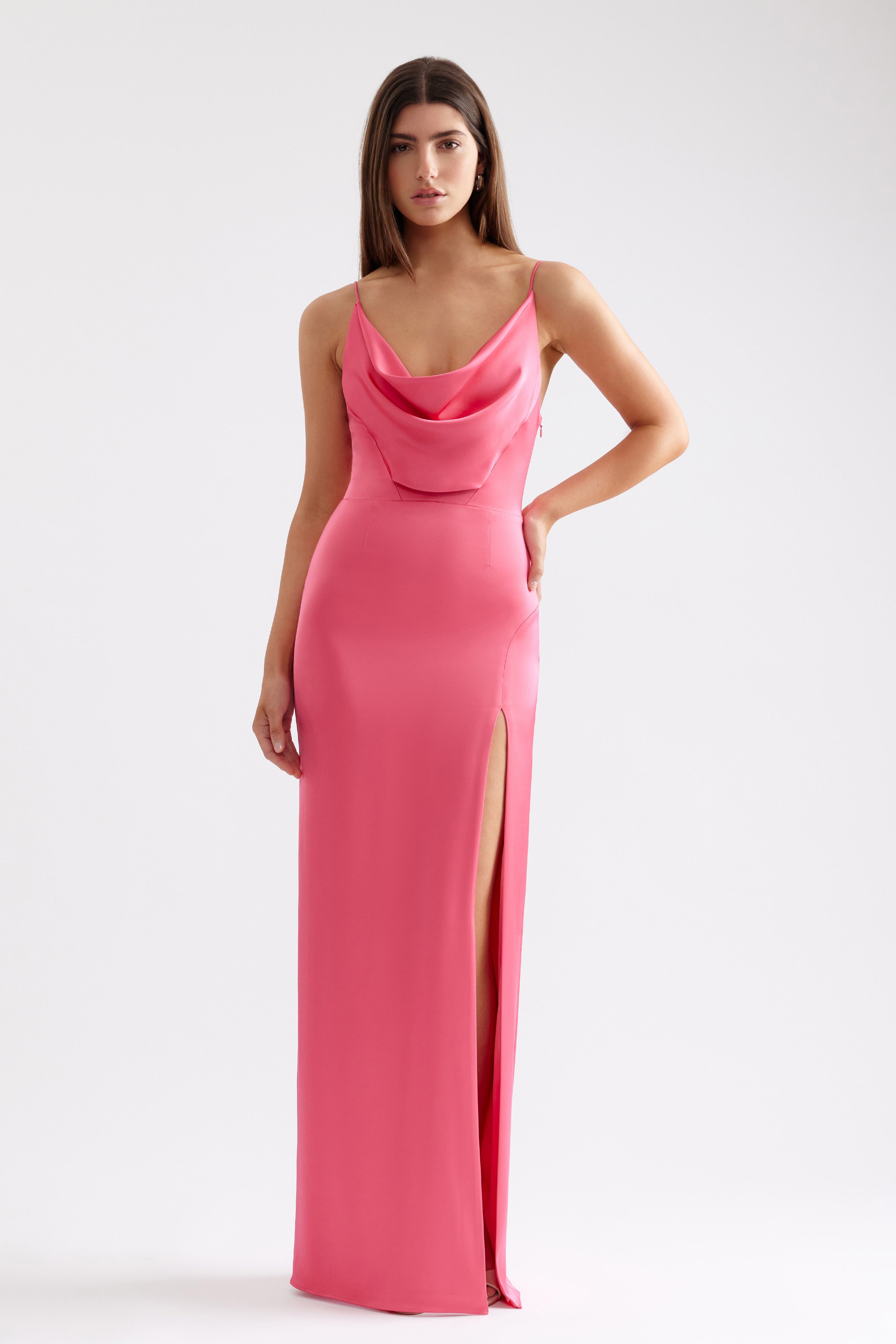 Marion Dress with sleek silhouette, draped neckline, thin straps and high side split in vibrant deep pink by Studio Lexi