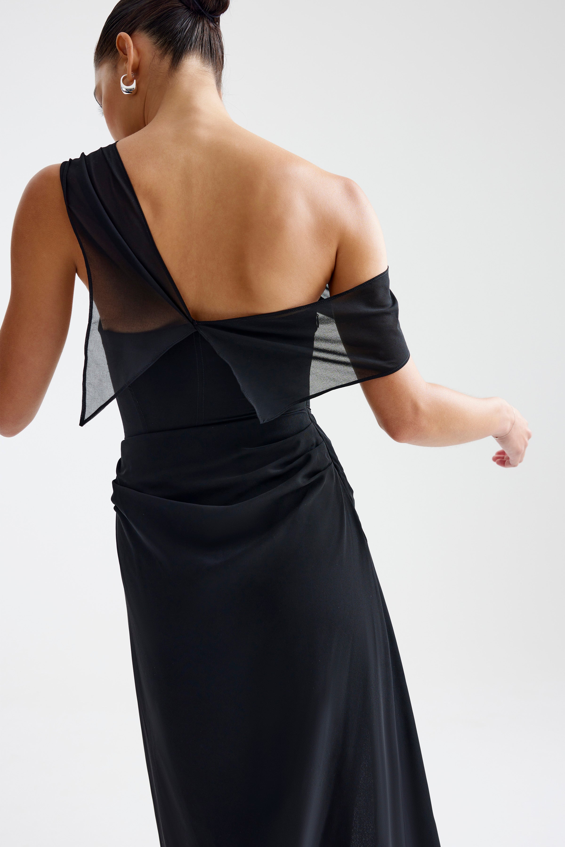 Mirelle Dress featuring a one-shoulder sheer draped sleeve and elegant back design in black for formal occasions by Studio Lexi