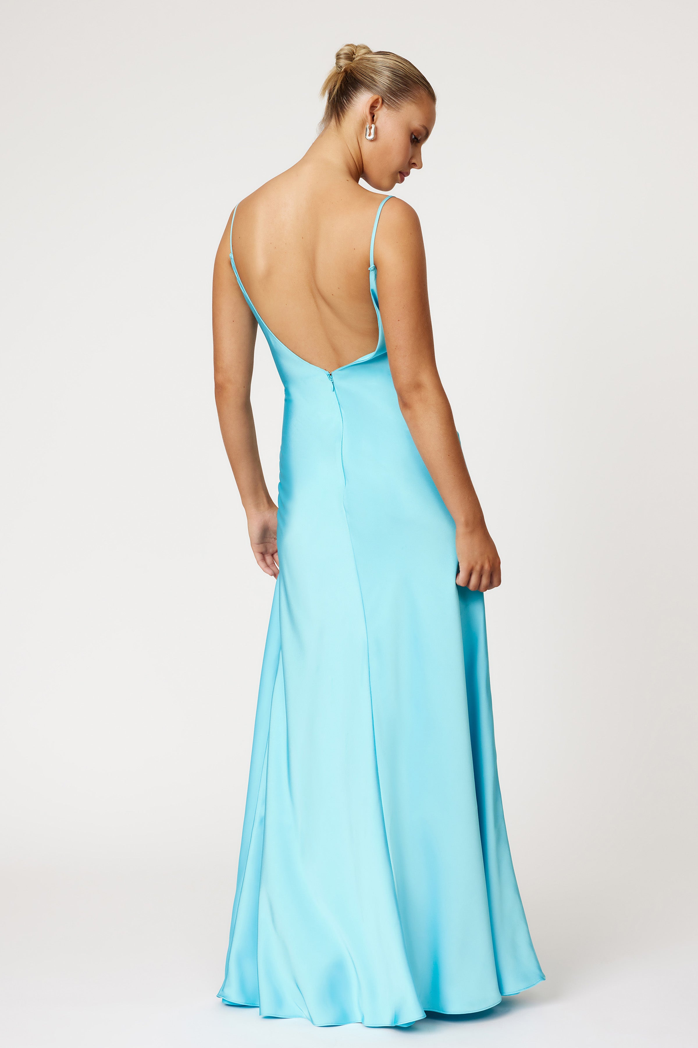 Monroe Dress featuring a backless design with slim straps and flowing silhouette in lagoon blue by Studio Lexi