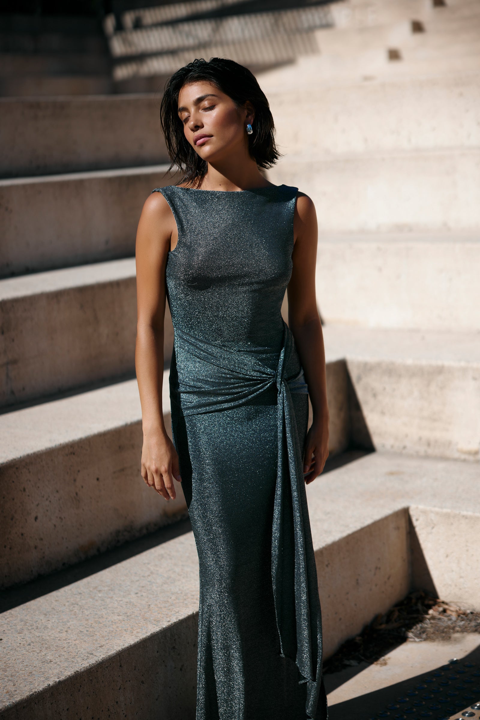 Nahla Dress silver with sleeveless fitted silhouette and elegant draped knot detail for formal and evening occasions by Studio Lexi