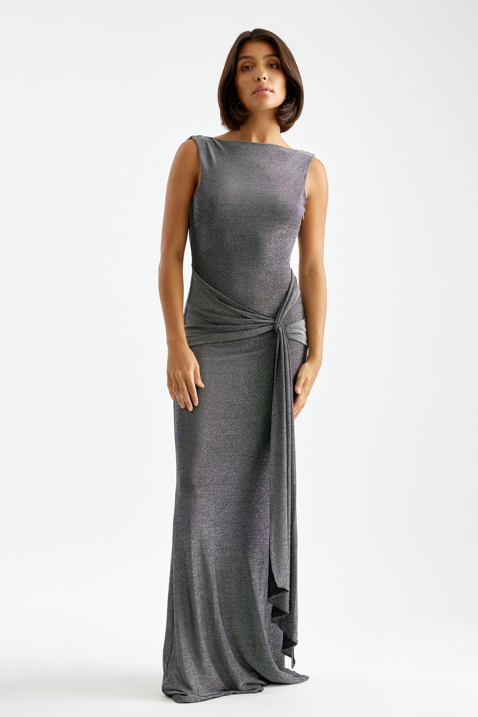 Nahla Dress with sleeveless fit and side draped knot detail in shimmering silver for formal and evening occasions by Studio Lexi