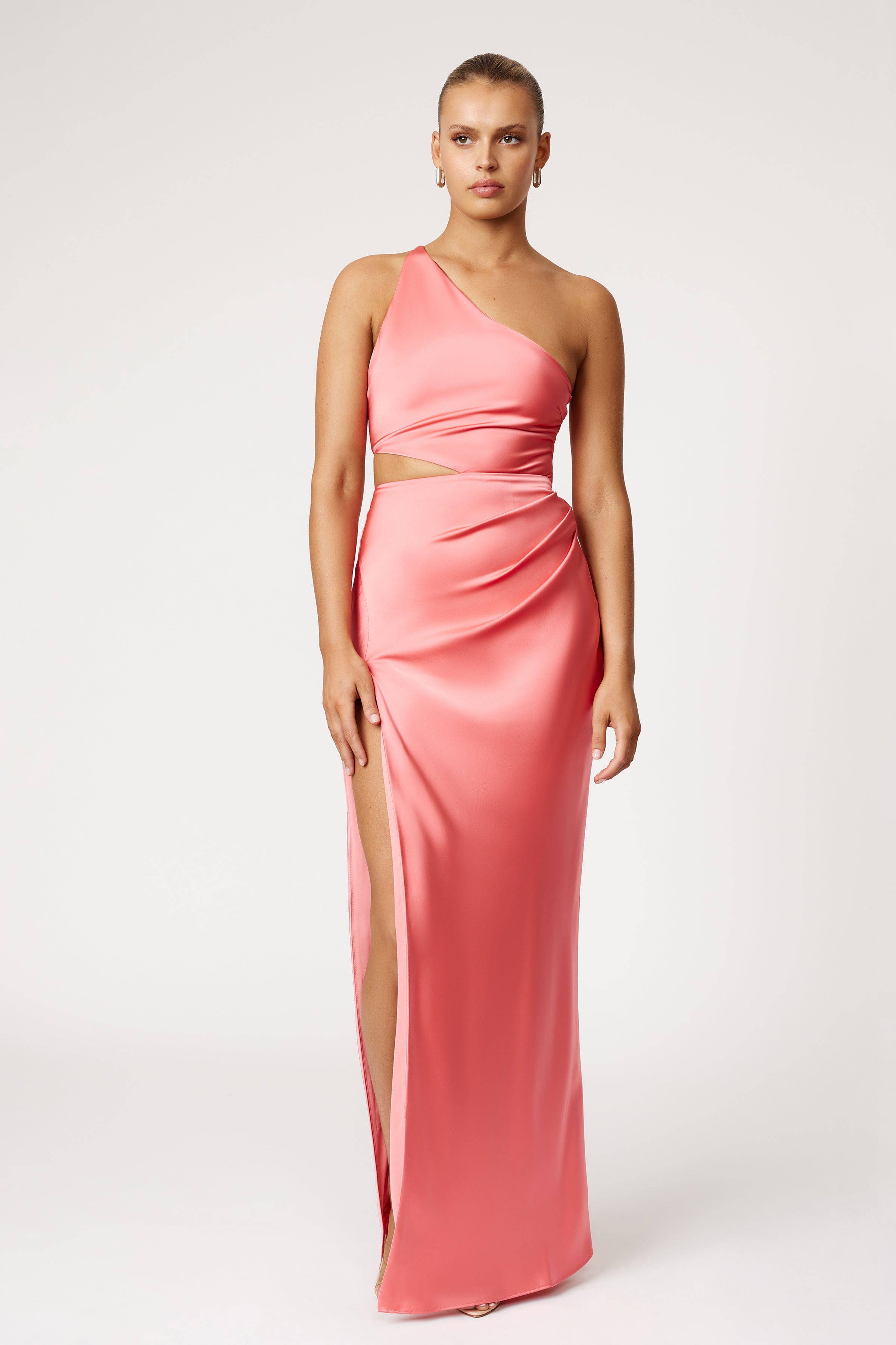 Narelle Dress featuring one-shoulder design with side cutout and high split in vibrant watermelon for formal occasions