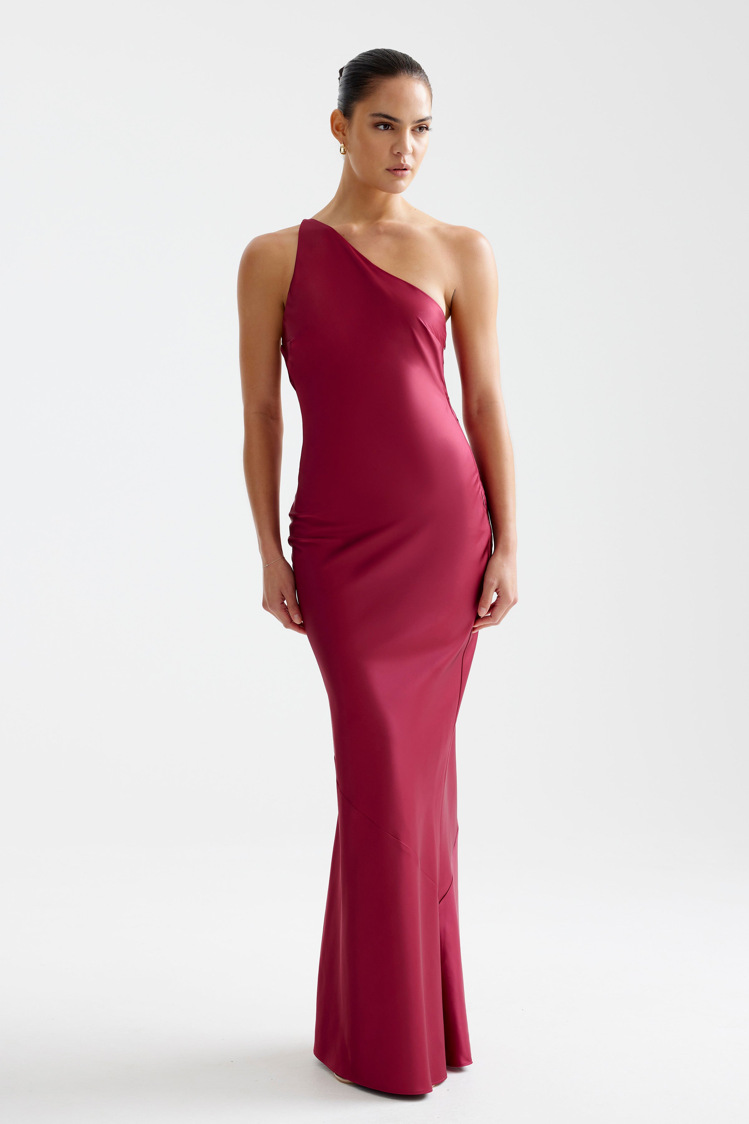 Nola Dress featuring an elegant one-shoulder design in wine with a sleek silhouette for formal and black tie occasions