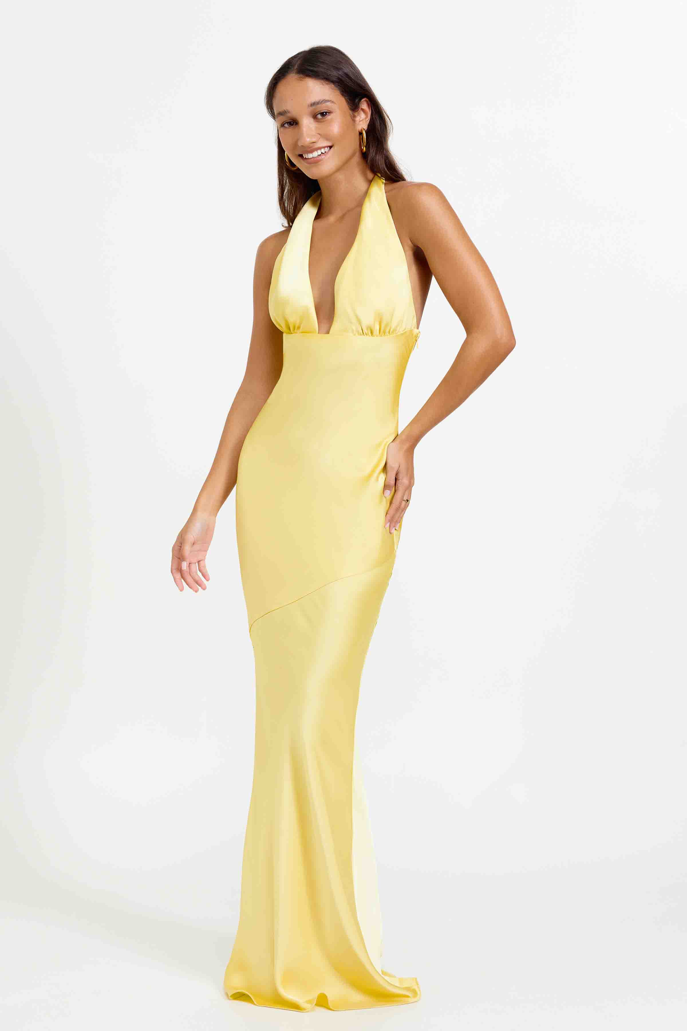 Novia Dress featuring a plunging halter neck and sleek silhouette in pineapple yellow for formal occasions