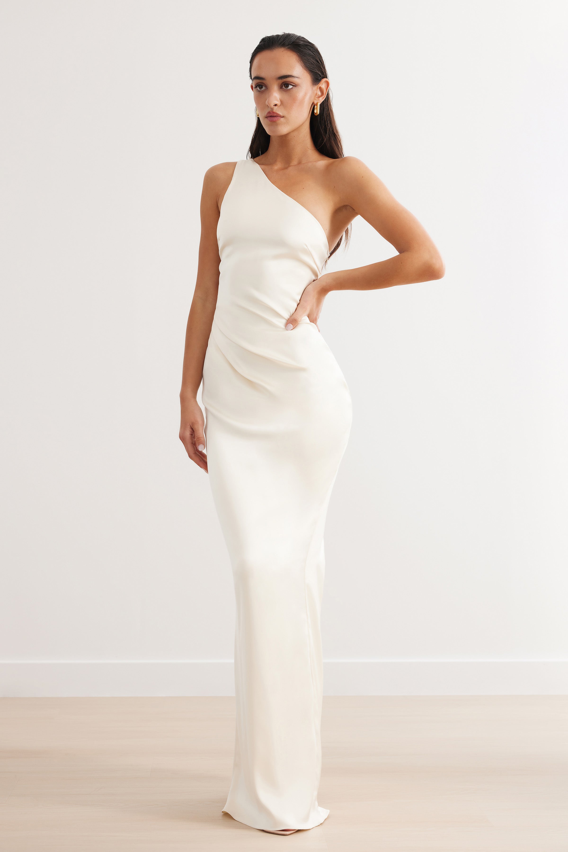 Oriana Dress featuring a one-shoulder silhouette in cream satin with a sleek fit for formal and black tie events