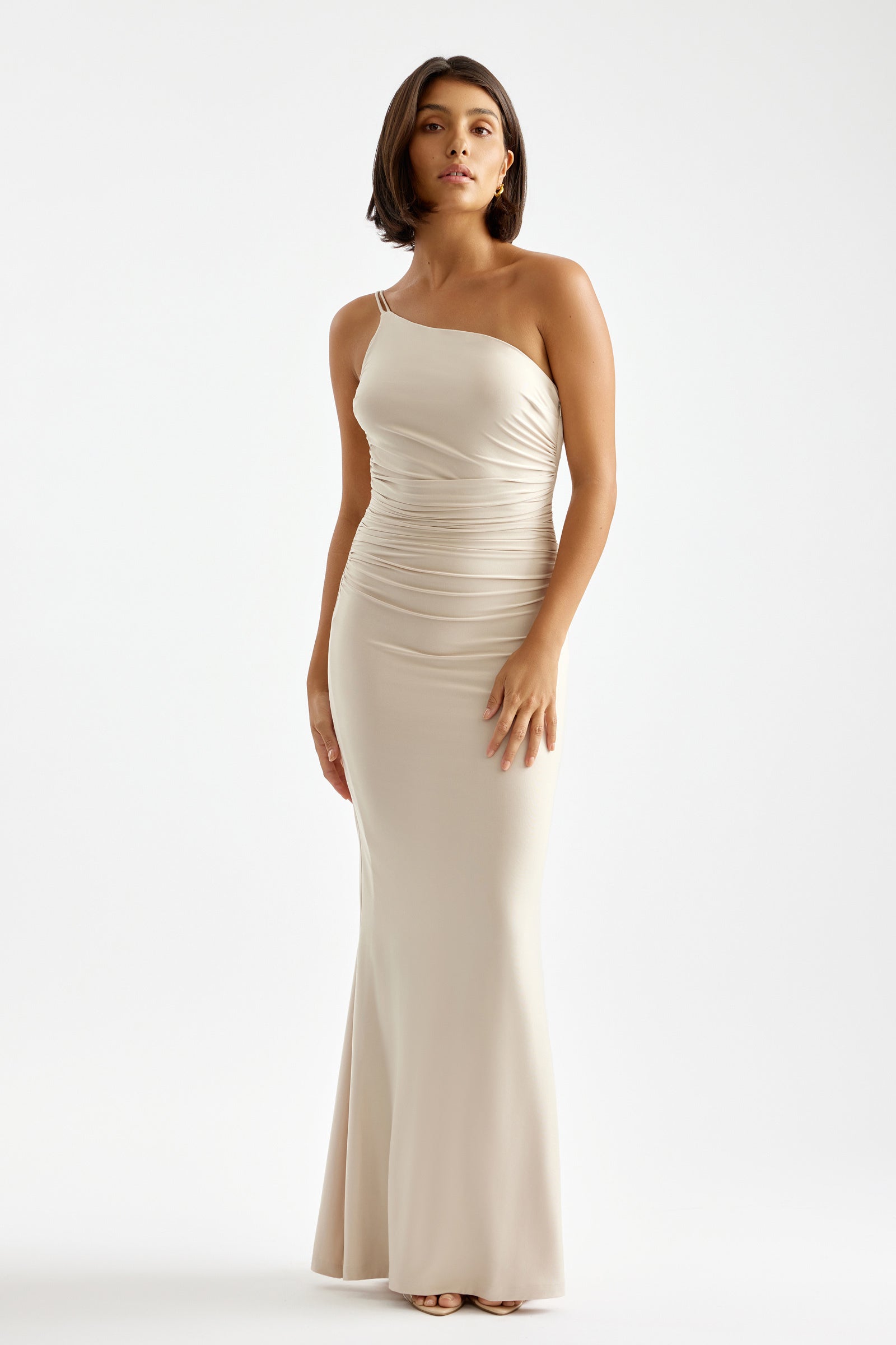 Paloma Dress featuring one-shoulder neckline, backless design, and ruched waist in almond for formal and bridesmaid occasions