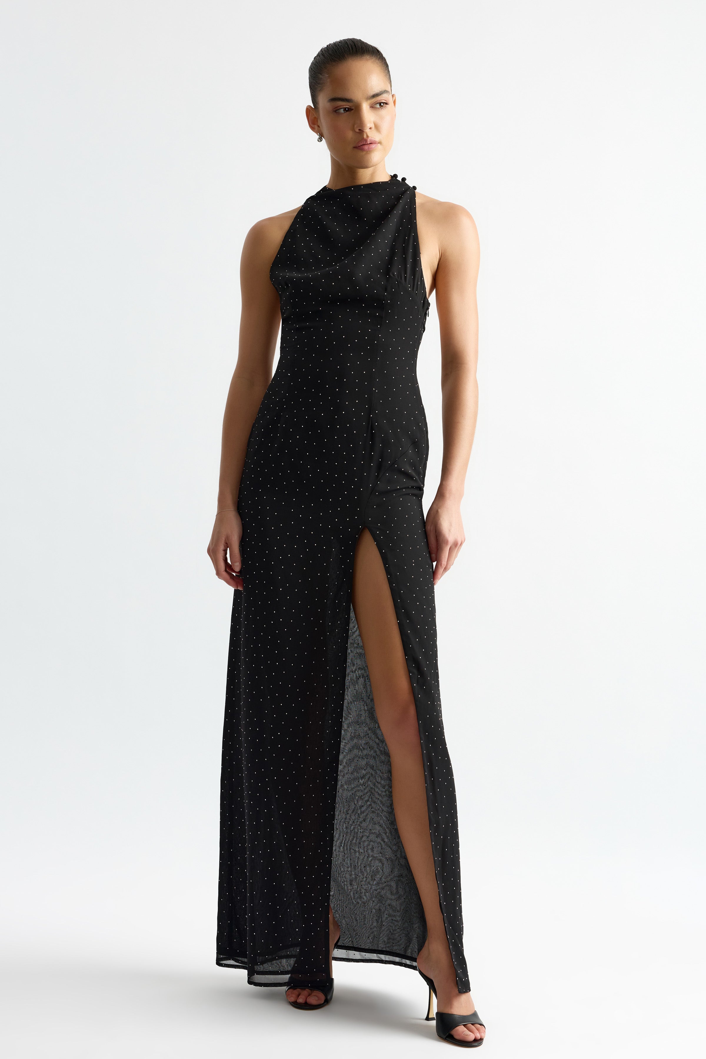 Rachelle Dress featuring a high neckline and thigh-high slit with subtle sparkle detailing in black by Studio Lexi