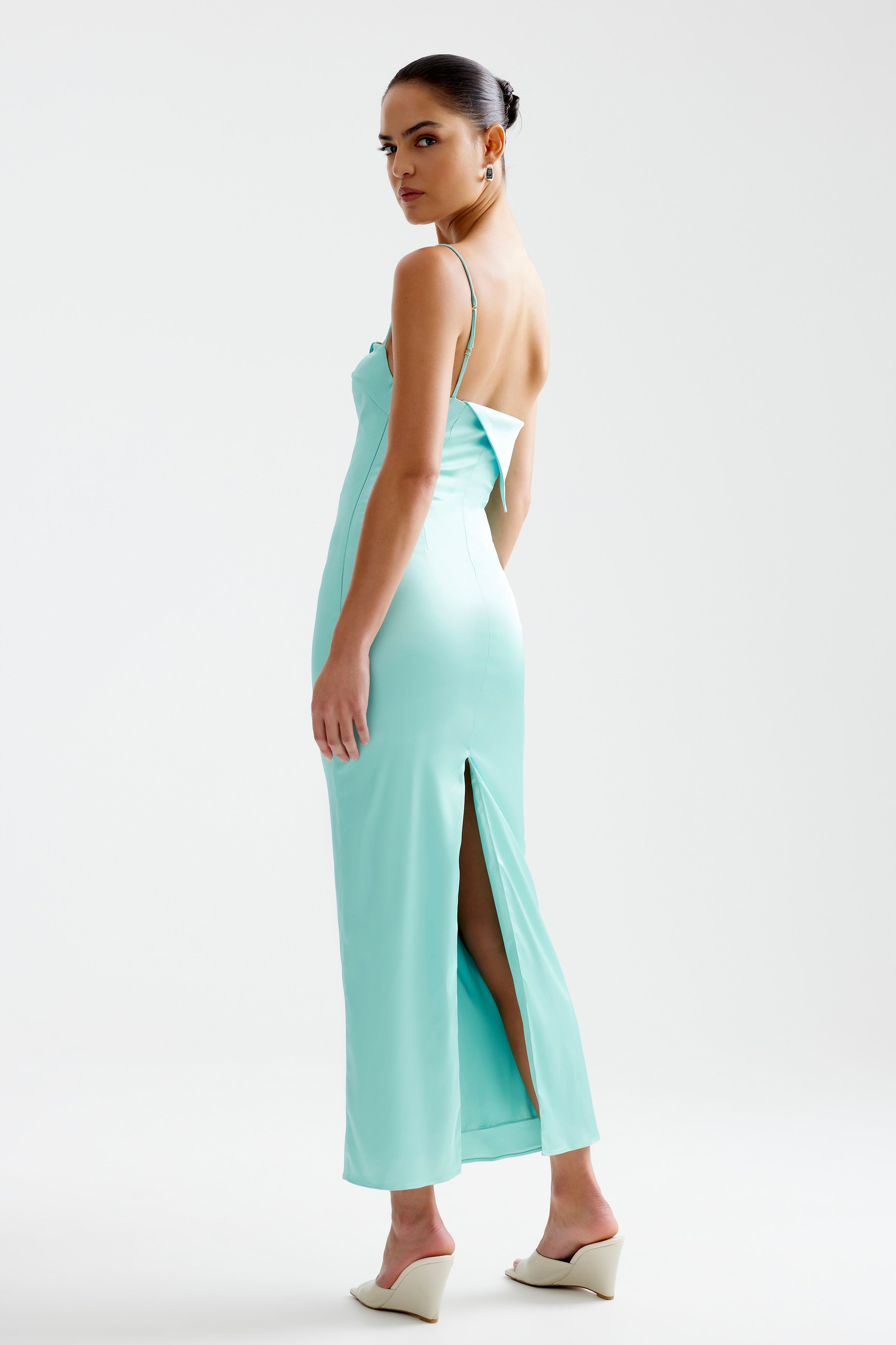 Rayna Dress featuring a backless design with thin straps and side split in elegant aqua for formal occasions