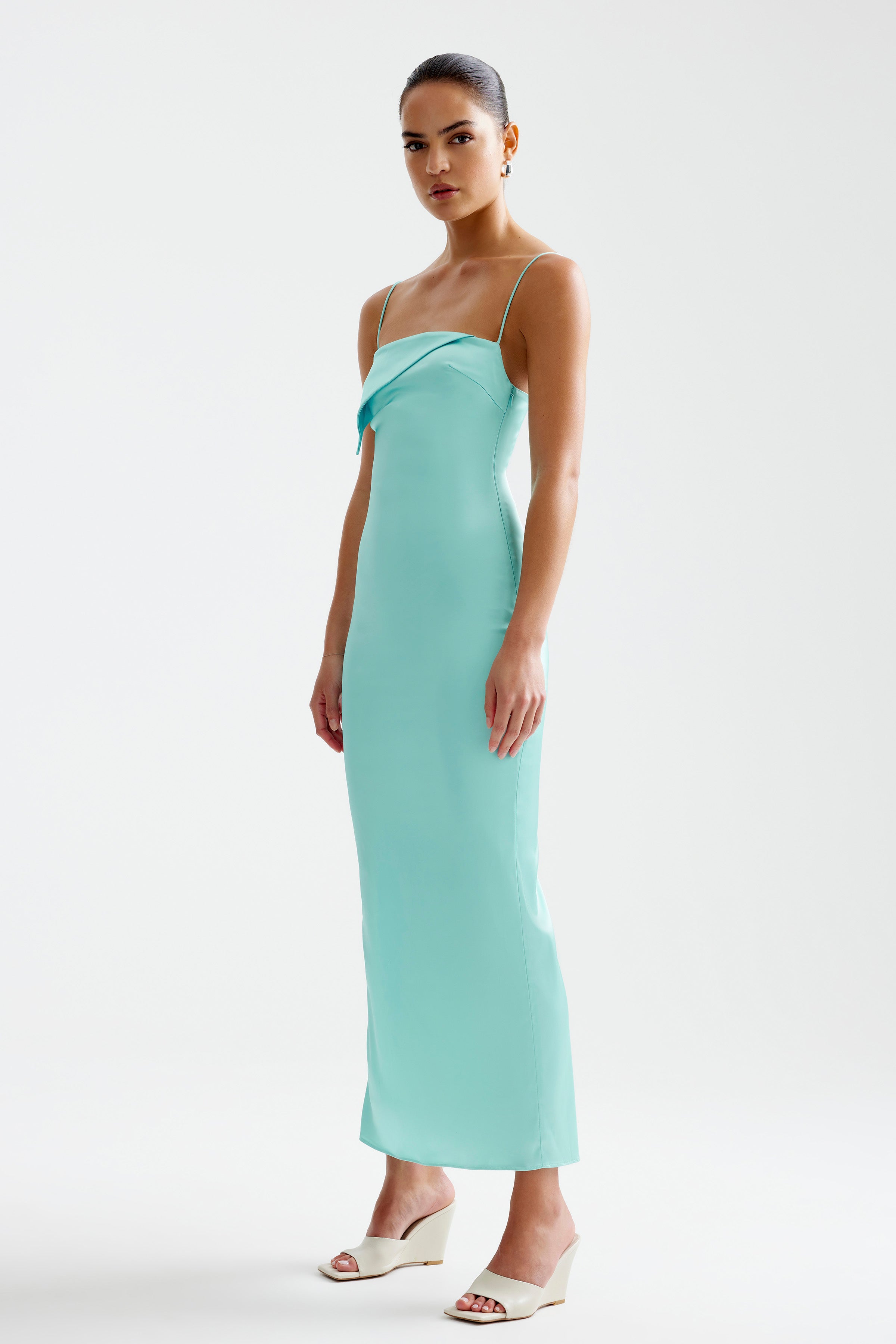 Rayna Dress featuring a sleek silhouette with thin straps and a folded neckline in aqua for formal and cocktail occasions