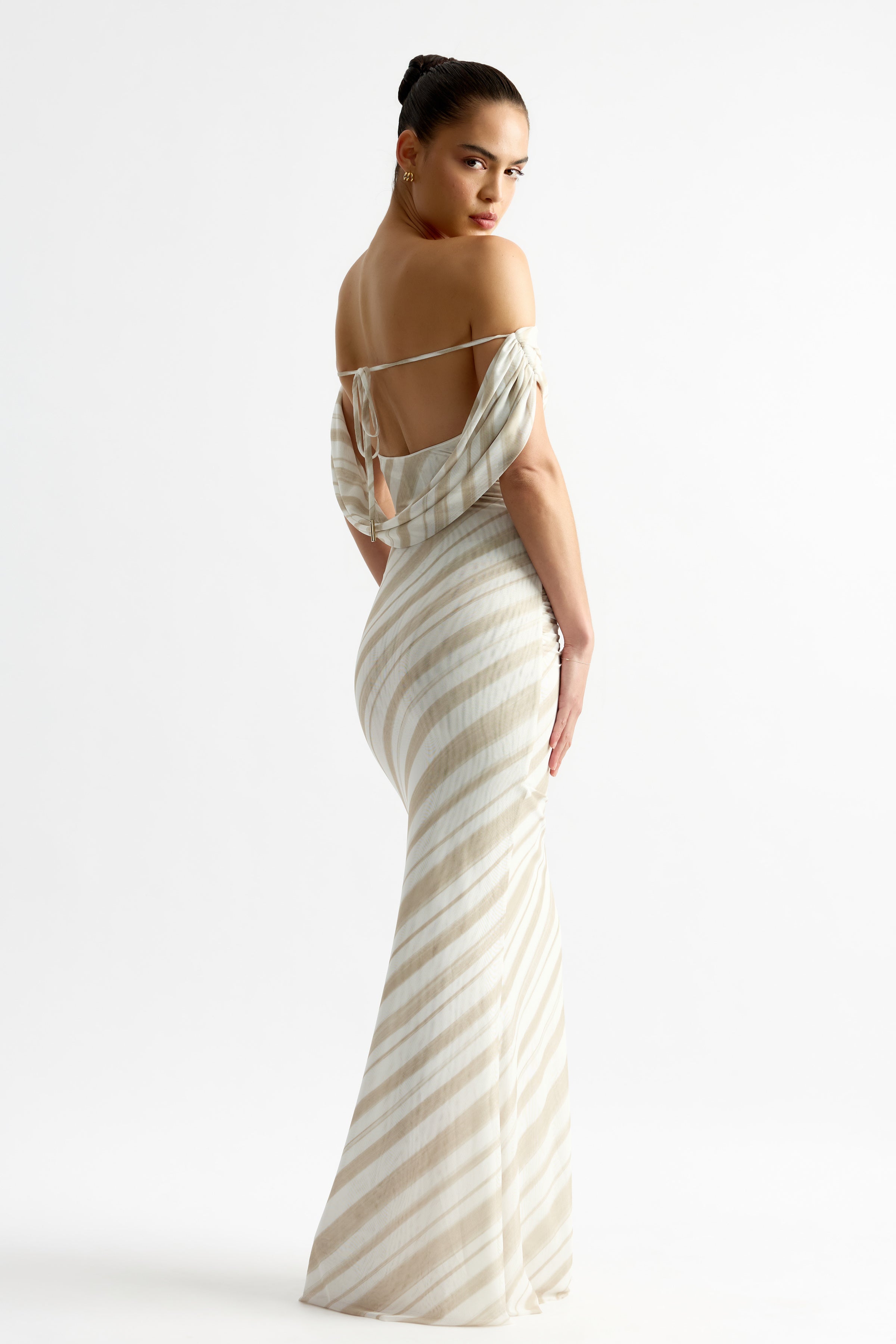 Sebastian Dress featuring a backless draped design with beige stripe print and tie detail by Studio Lexi for formal wear