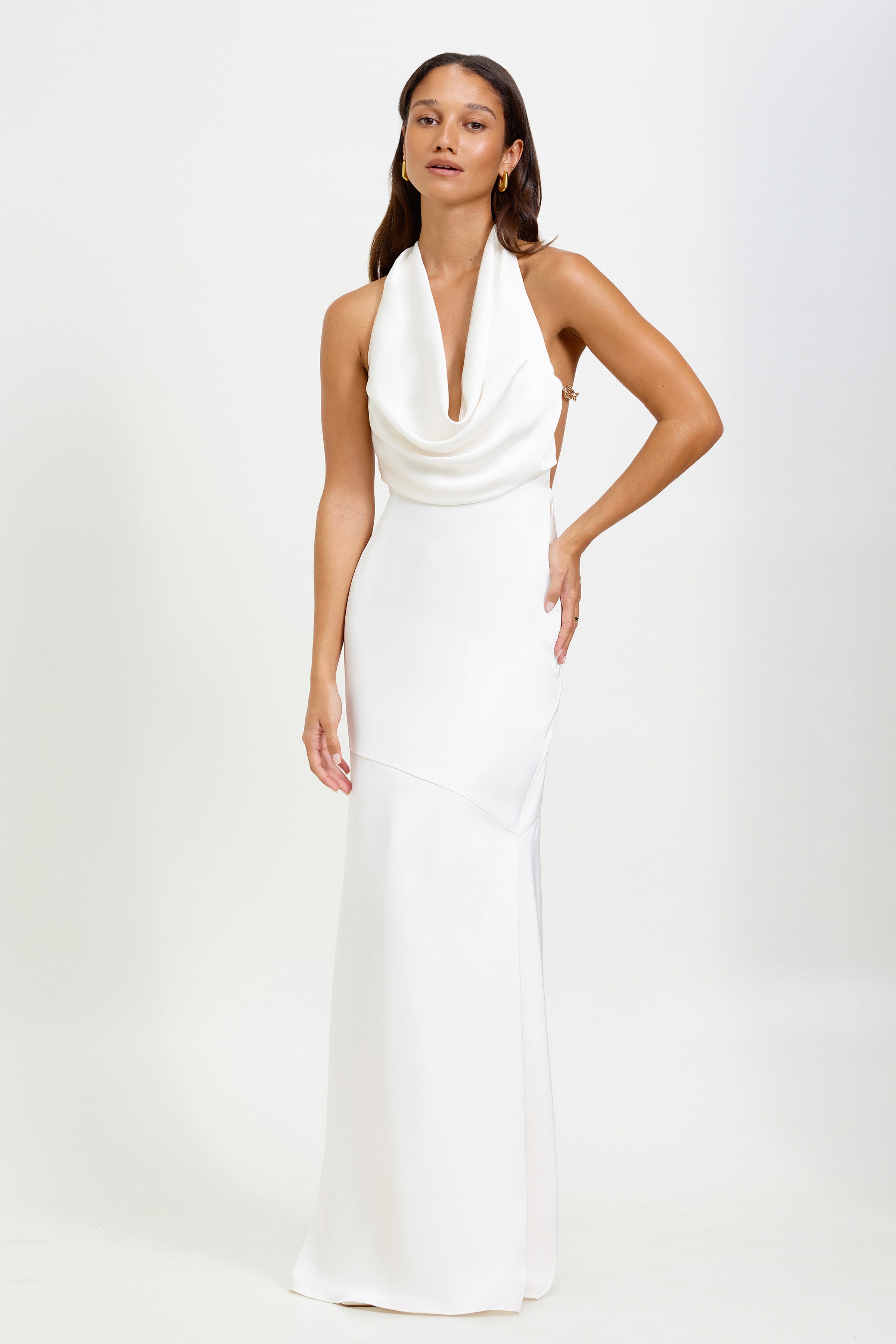 Silvana Dress featuring a draped halter neckline and backless silhouette in oyster for formal and black tie occasions