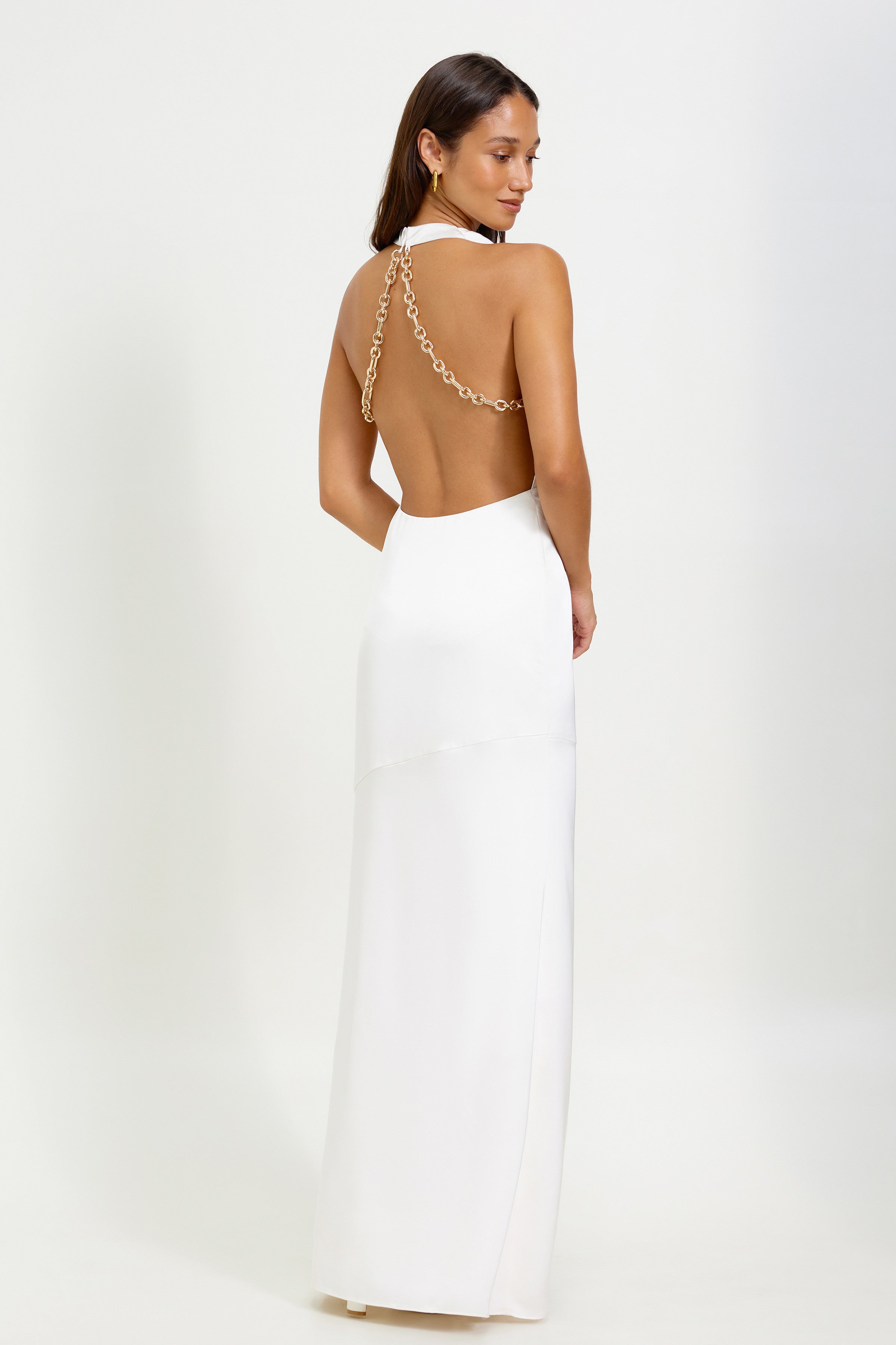 Silvana Dress featuring a backless silhouette with chain detail in soft oyster for elegant formal occasions