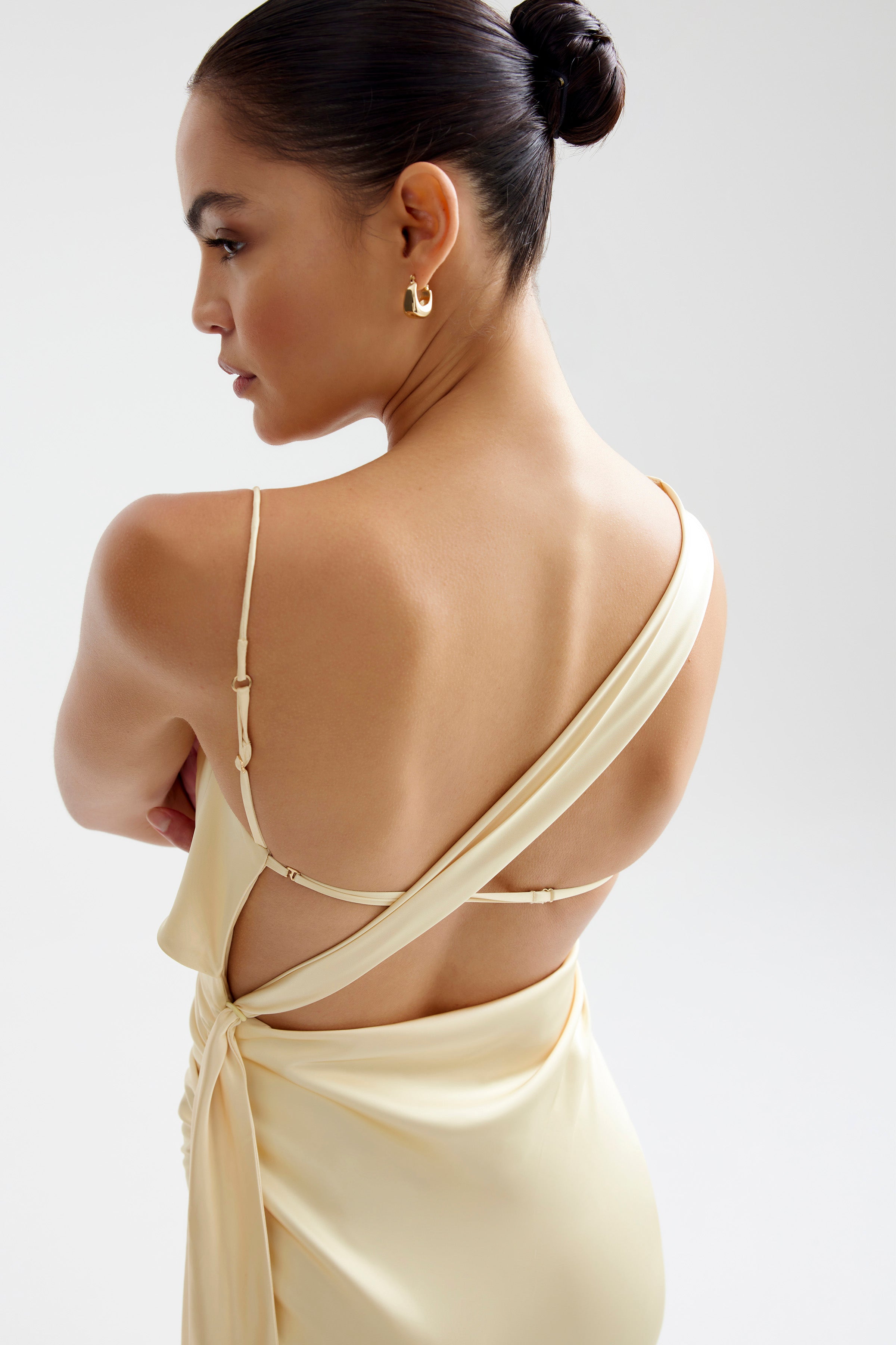 Sophie Dress featuring an elegant backless design with adjustable straps in limoncello for cocktail and day occasions by Studio Lexi