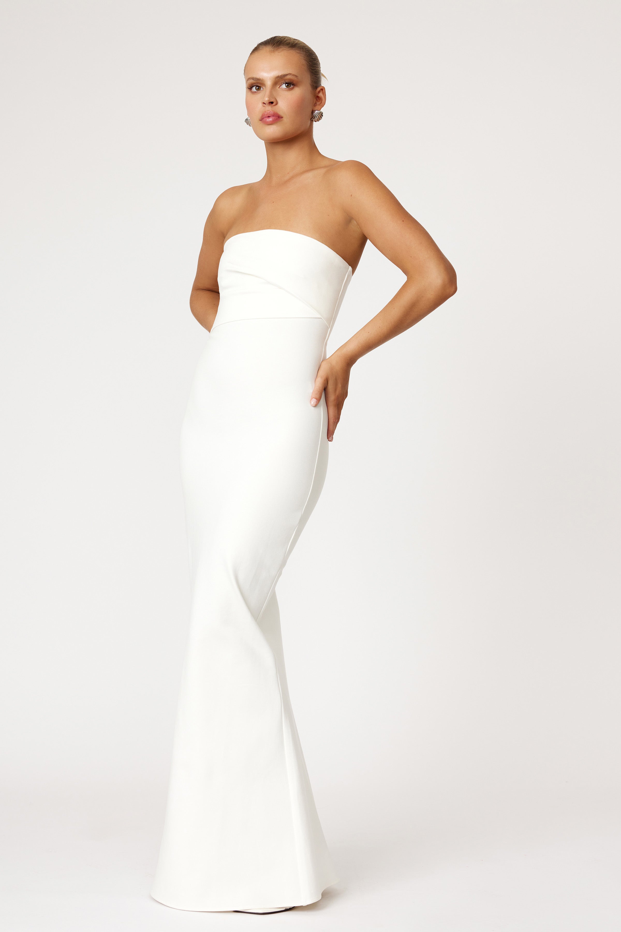 Tajo Dress strapless design with fitted waist and floor-length silhouette in white for formal and bridesmaid occasions by Studio Lexi