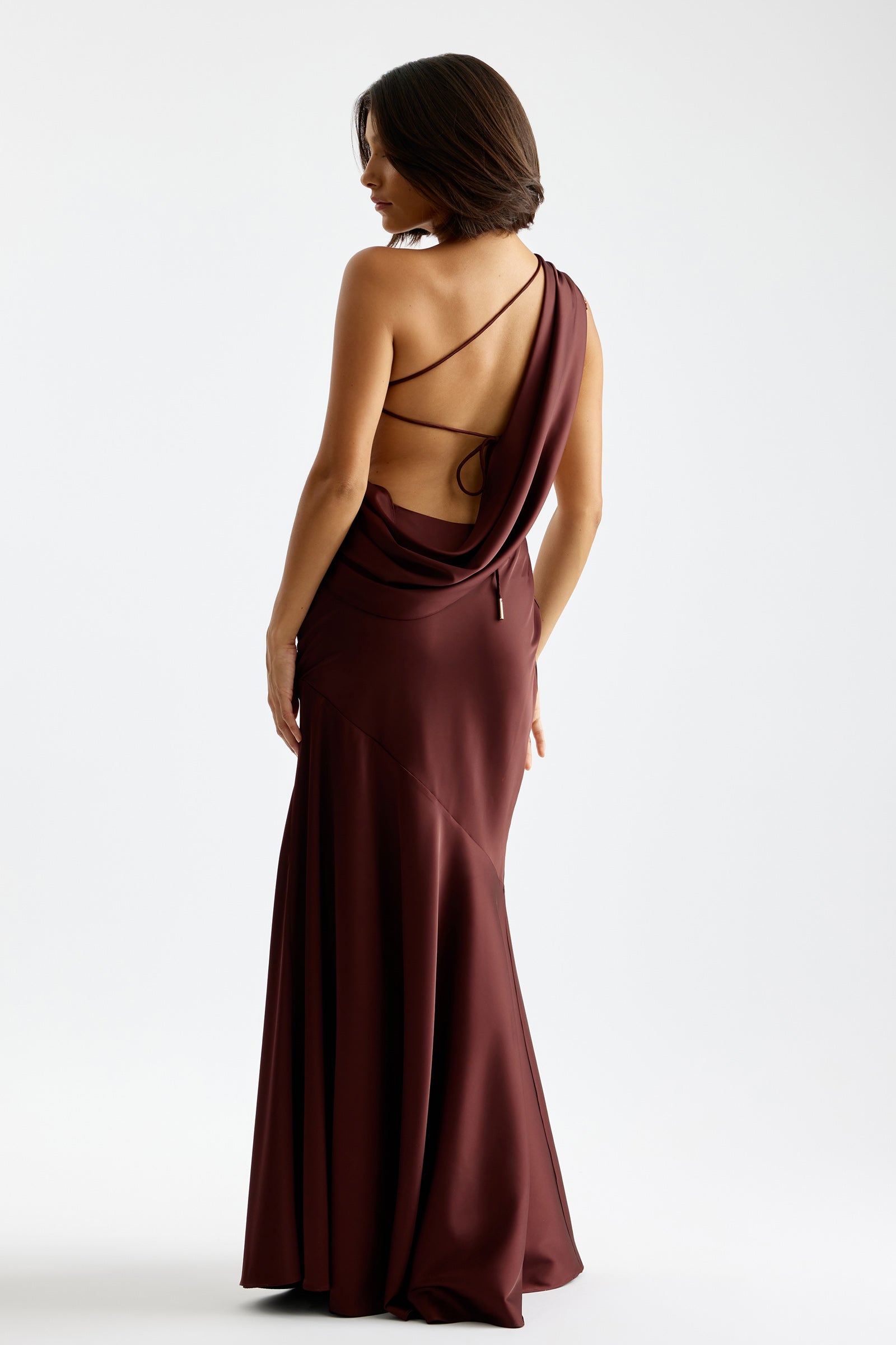Tala Dress featuring a draped backless design with thin straps in deep plum for formal and black tie occasions by Studio Lexi