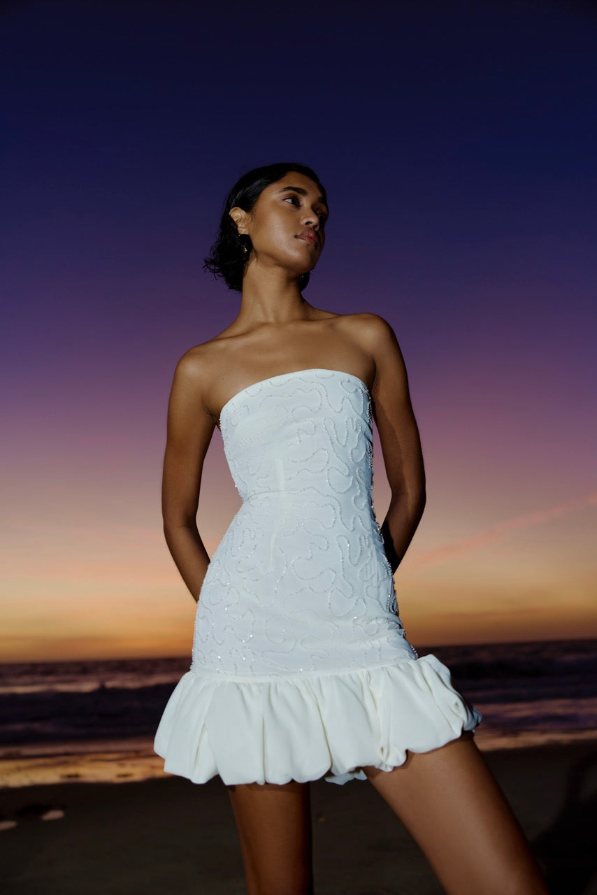 Tiana Dress featuring strapless design with floral embroidery and ruffled hem in ivory for elegant cocktail occasions by Studio Lexi