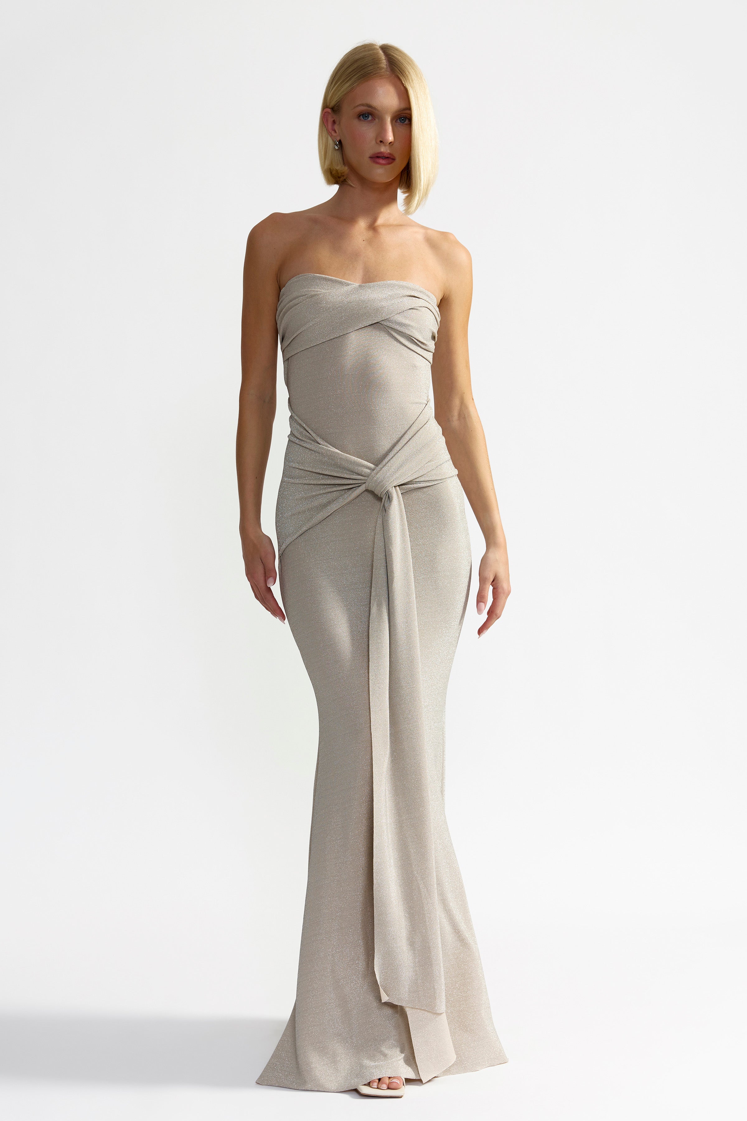 Tiffany Dress strapless silhouette with twisted knot and draped detail in elegant champagne for formal black tie occasions