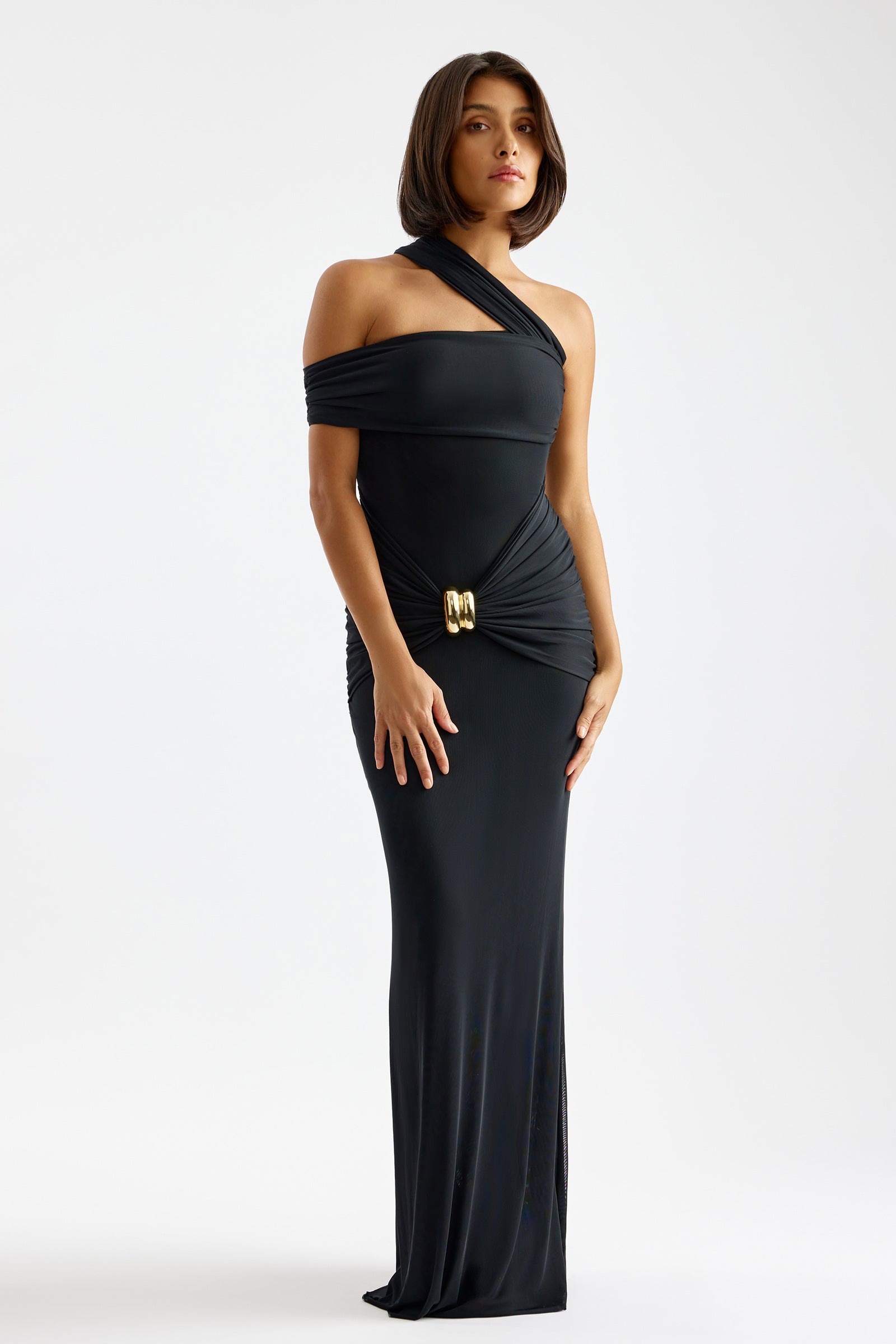 Veda Dress black with asymmetric one-shoulder design, off shoulder sleeve, and gold buckle detail by Studio Lexi for formal wear