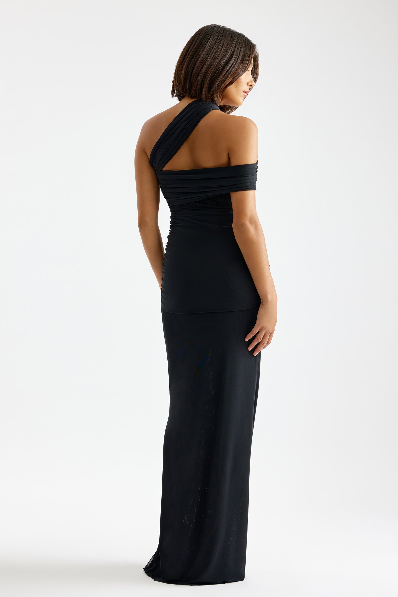 Veda Dress with asymmetric off-shoulder sleeves and fitted silhouette in black for formal and black tie occasions by Studio Lexi