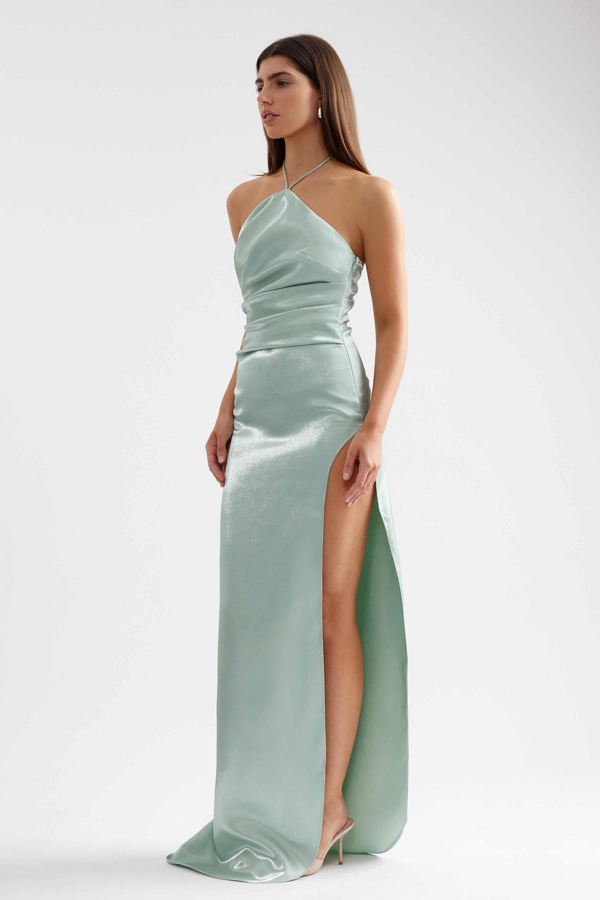 Vera Dress sleek halter gown with high side split and small train in pistachio satin for formal and black tie events