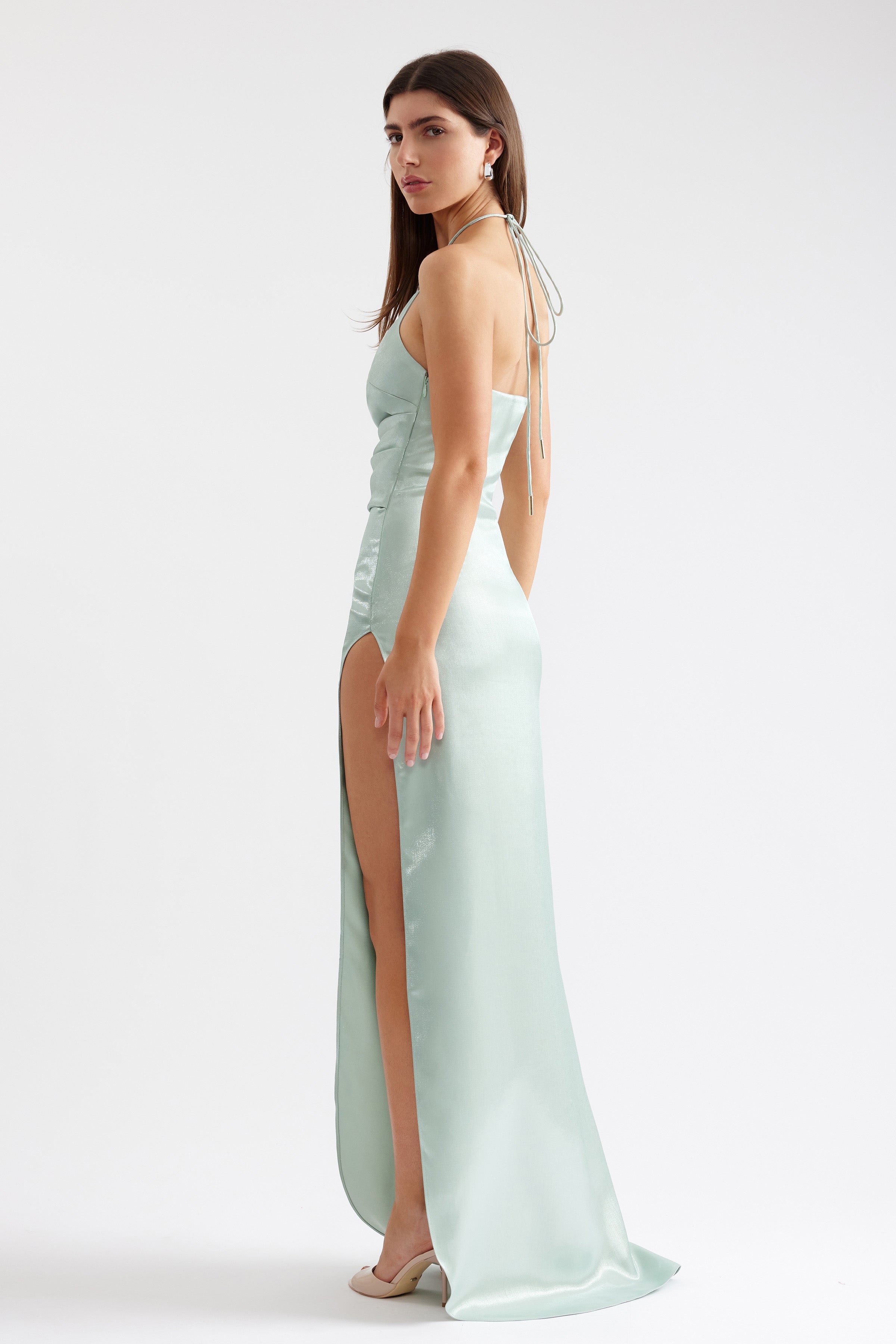 Vera Dress sleek halter gown with high side split and small train in pistachio for formal and black tie occasions by Studio Lexi
