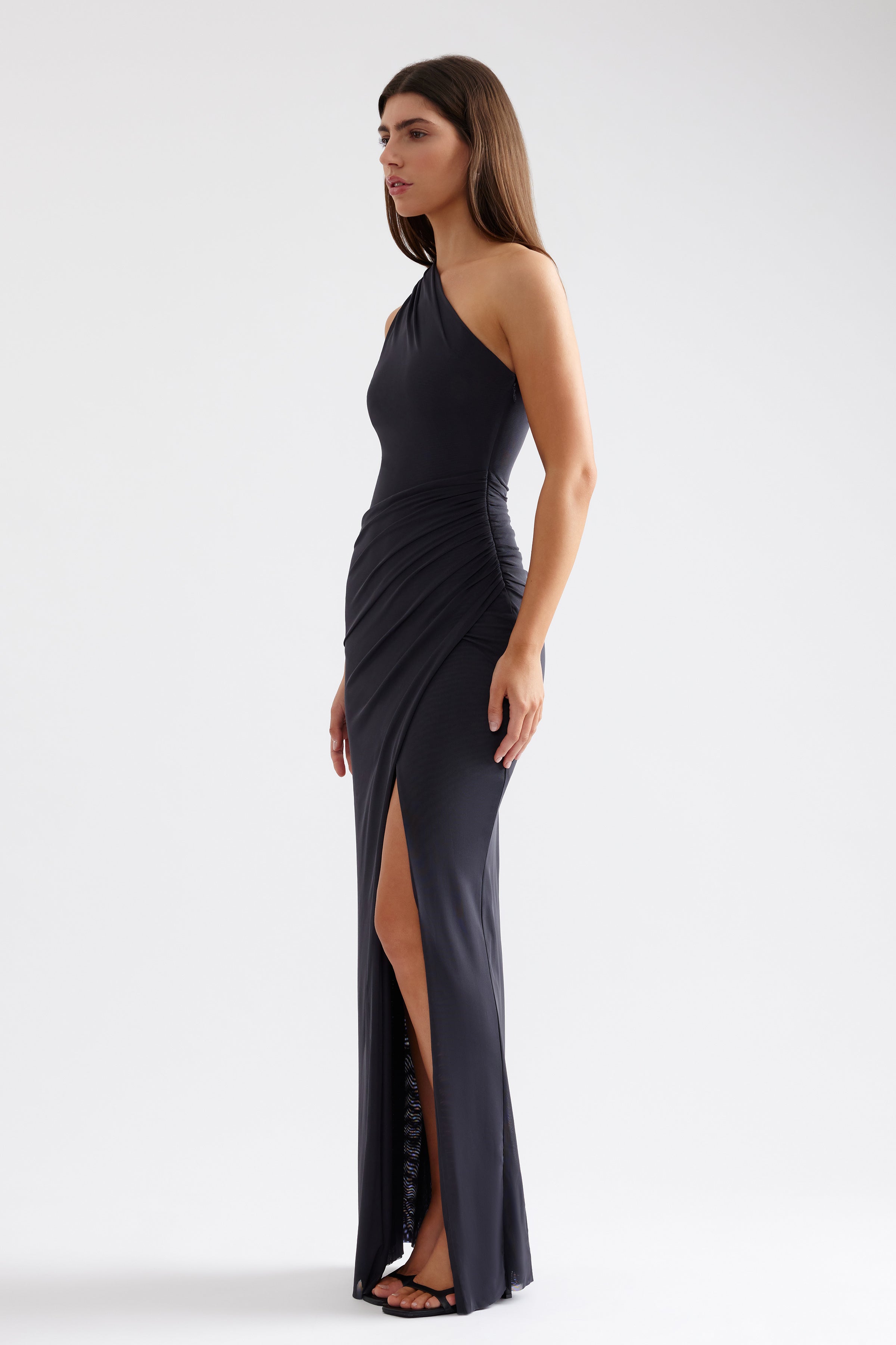 Viola Dress one-shoulder gown with side ruching and high split in charcoal for formal black tie and party occasions