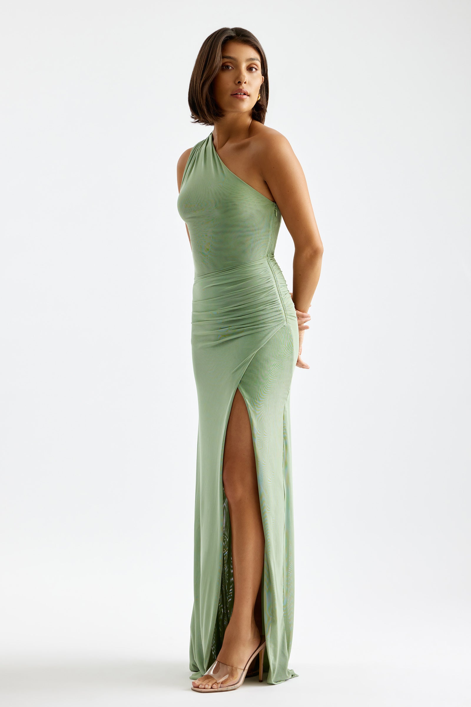 Viola Dress one-shoulder silhouette with ruched detail and thigh-high split in soft sage for cocktail and formal occasions by Studio Lexi