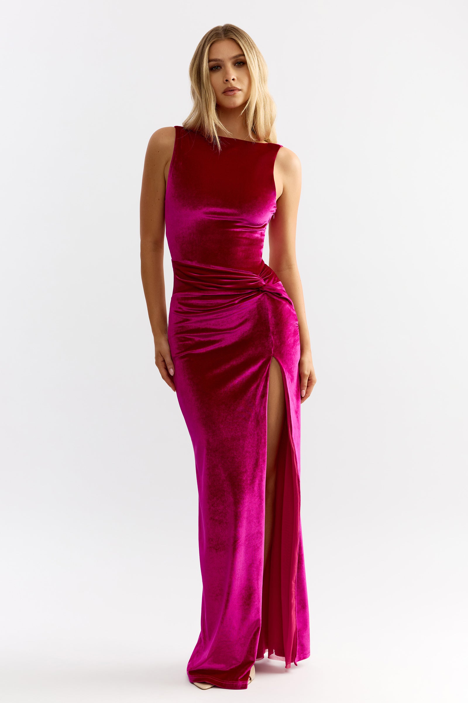 Whitney Dress featuring sleeveless silhouette with gathered waist and thigh-high slit in vibrant berry velvet by Studio Lexi