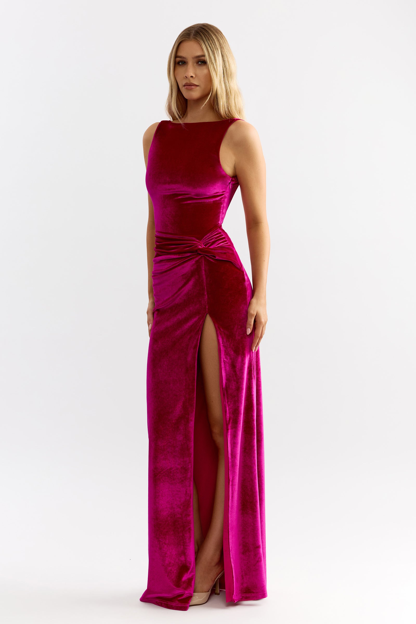 Whitney Dress featuring sleeveless silhouette with knotted waist detail and thigh-high slit in rich berry velvet by Studio Lexi