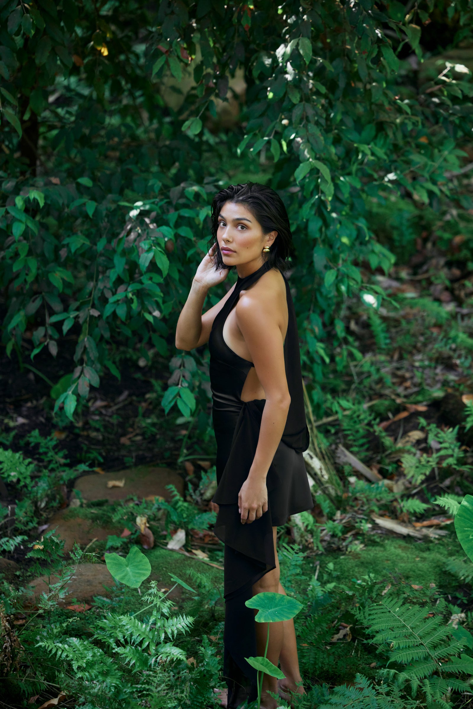 Willow Dress featuring a backless halter neck and asymmetric hemline in black for cocktail and party occasions by Studio Lexi