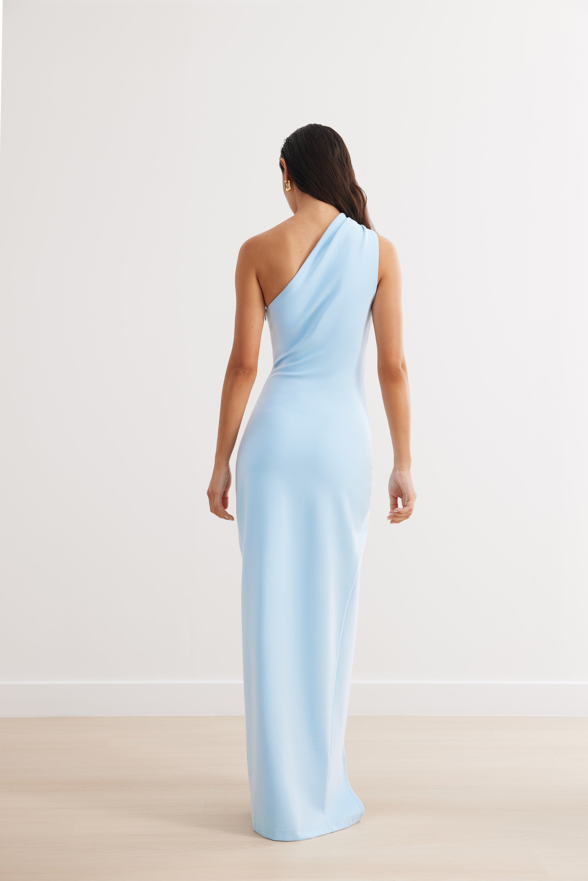 Yolanda Dress featuring an elegant one-shoulder silhouette in soft blue, designed for formal and black tie occasions