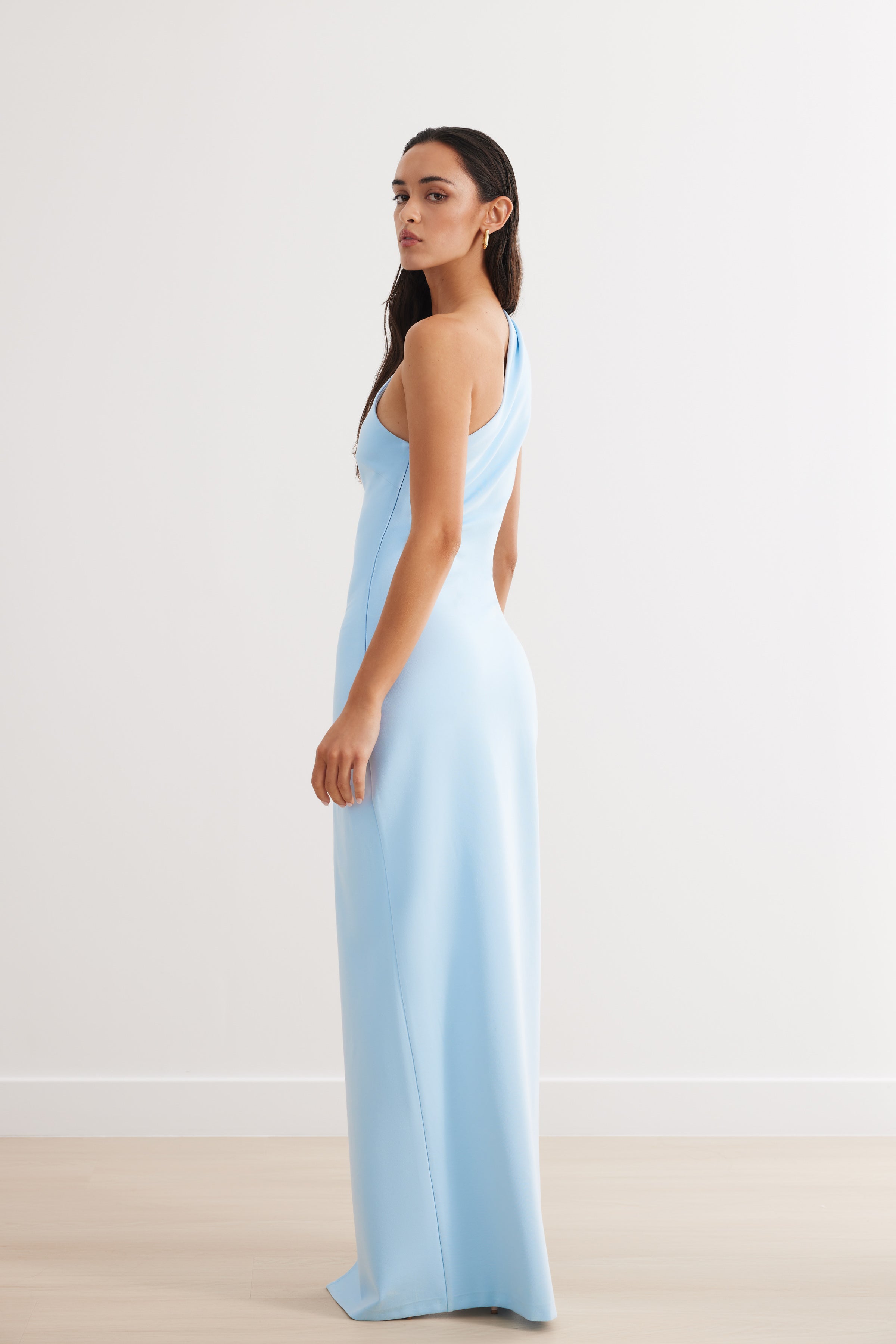 Yolanda Dress featuring a sleek one-shoulder design in light blue for elegant formal and wedding guest occasions