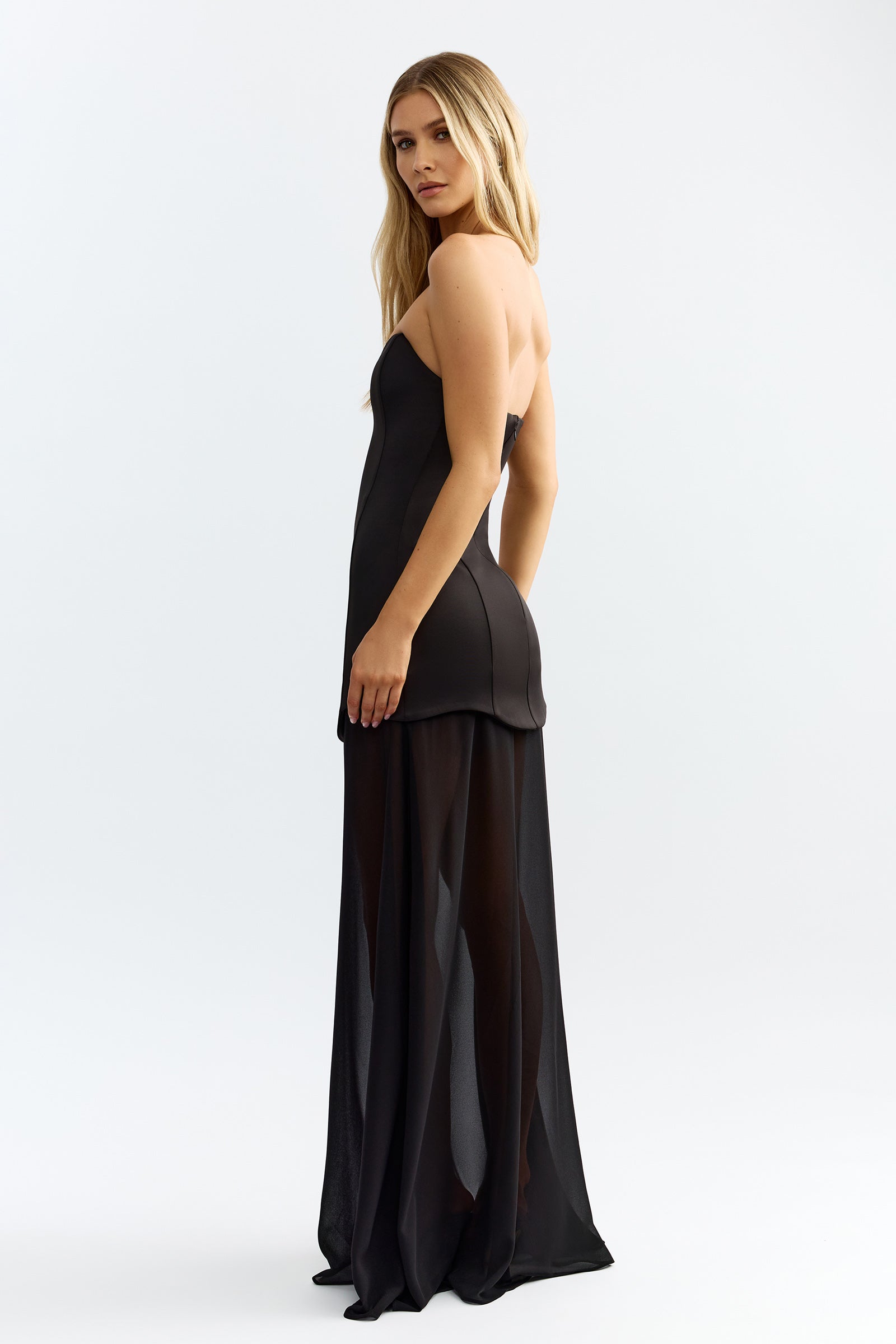 Zahra Dress featuring strapless backless design with fitted bodice and sheer black skirt for formal and black tie events by Studio Lexi